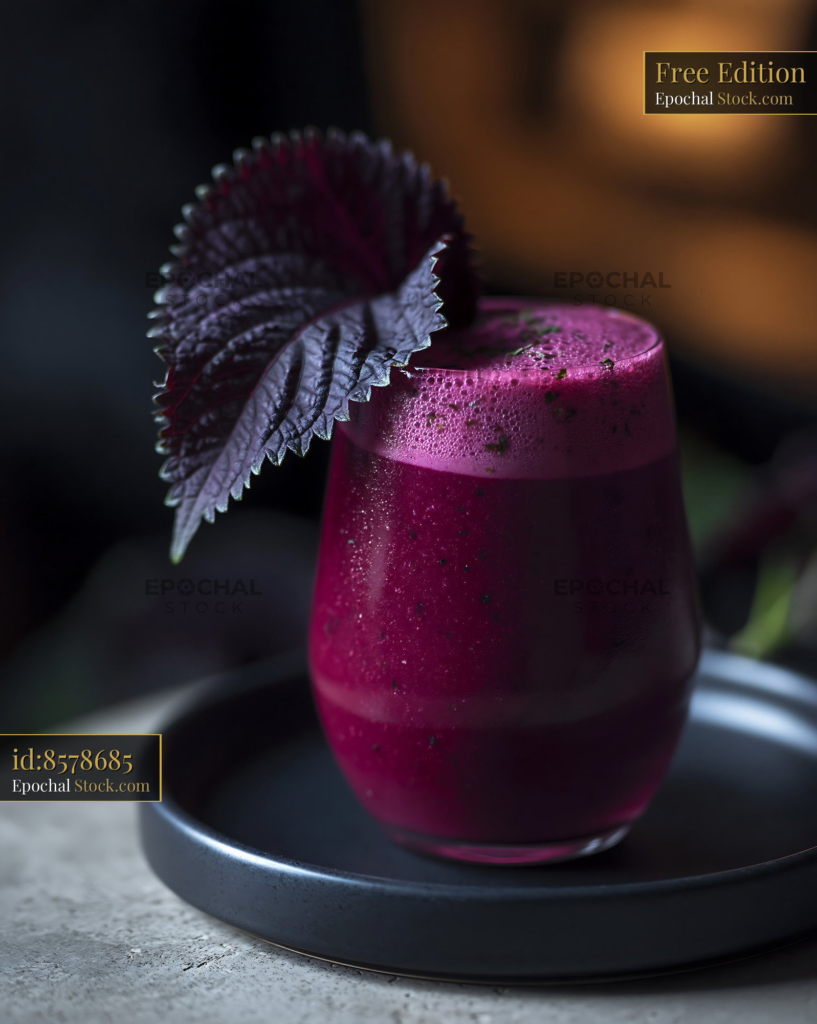 Fresh shiso leaf smoothie in a glass with moody lighting - stock photo