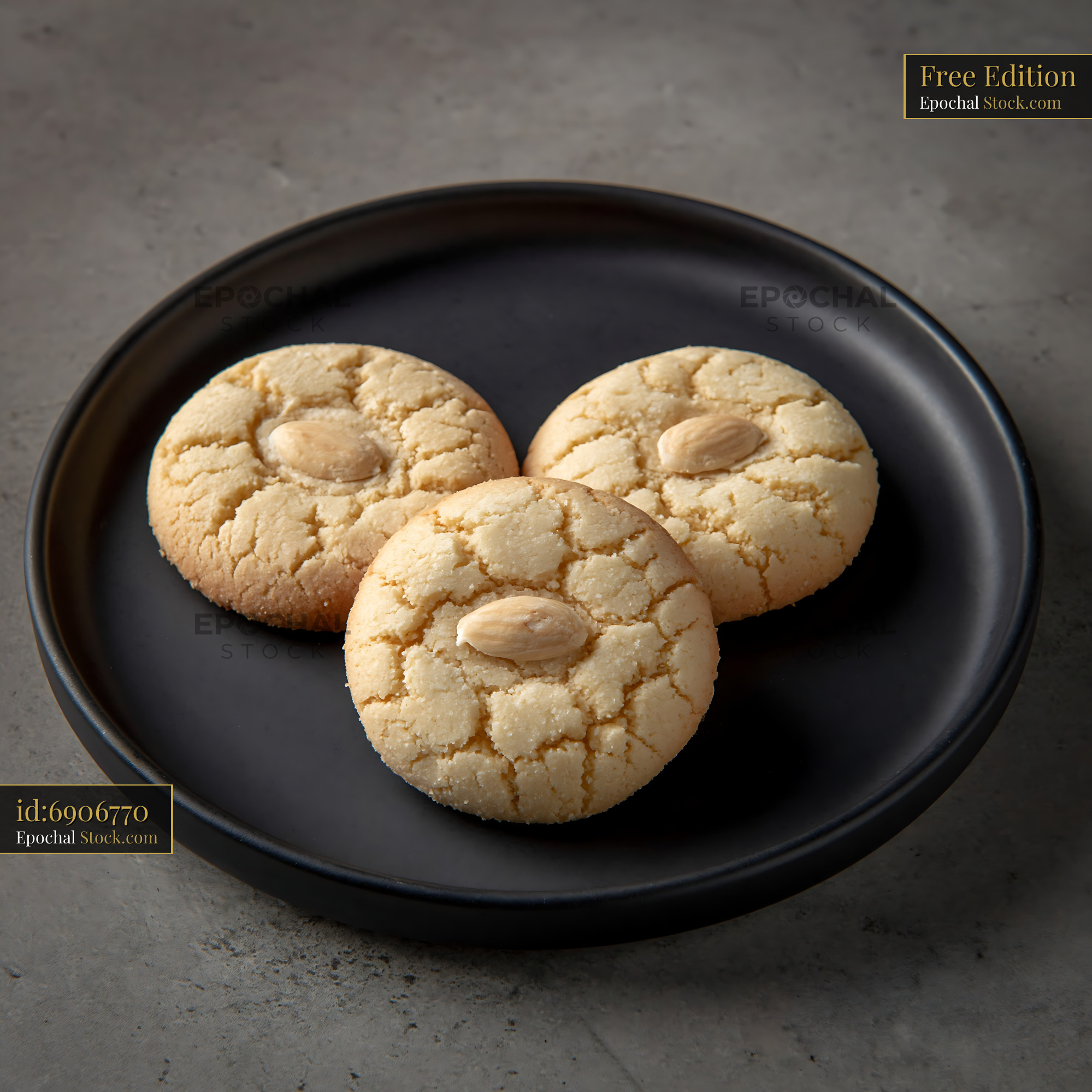 Traditional Turkish Acibadem Kurabiyesi almond cookies on black plate - stock photo