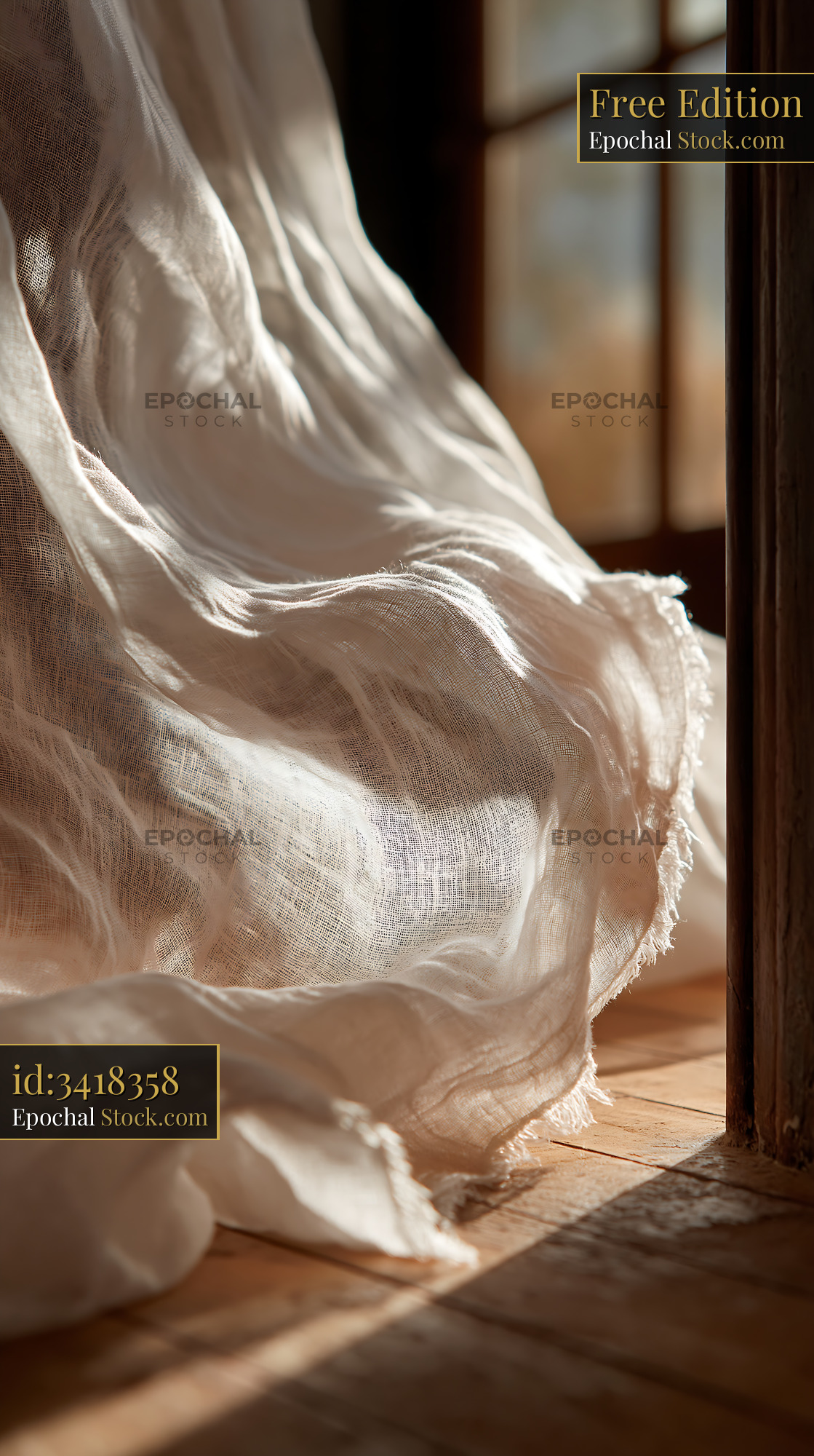 Soft white linen curtains fluttering in a gentle breeze at sunset - stock photo