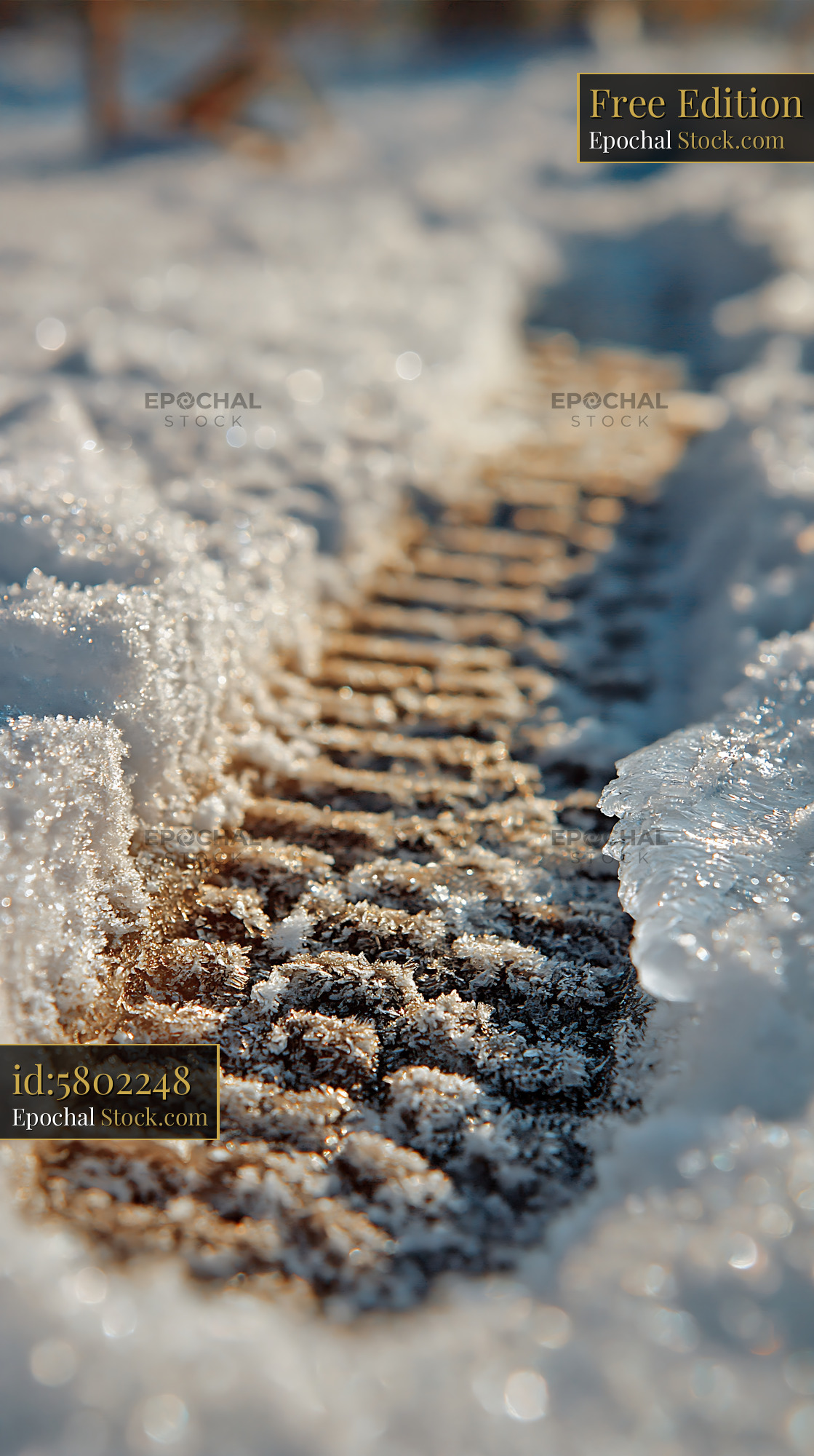 Detailed boot print in deep snow during golden hour - stock photo