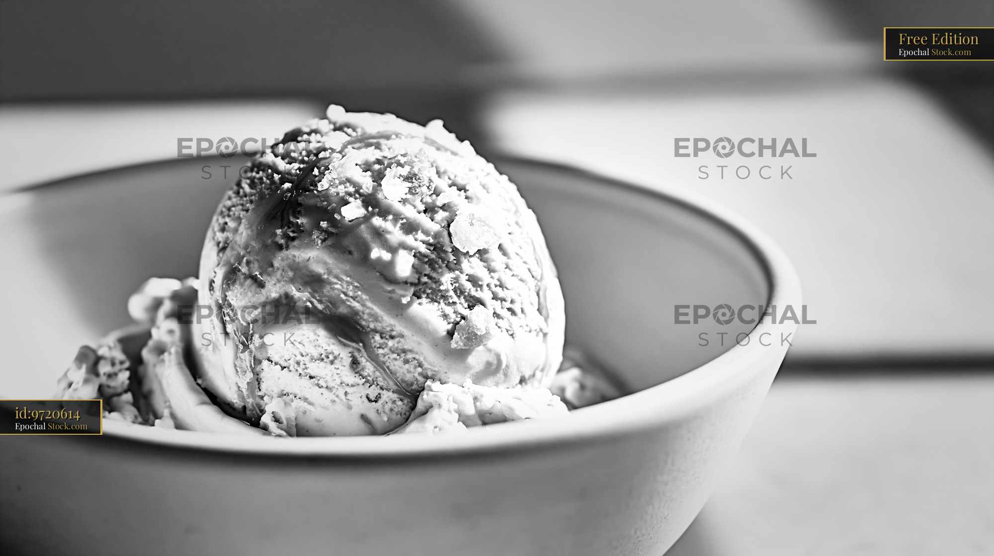 Scoop of fleur de sel caramel ice cream in a ceramic bowl - stock photo