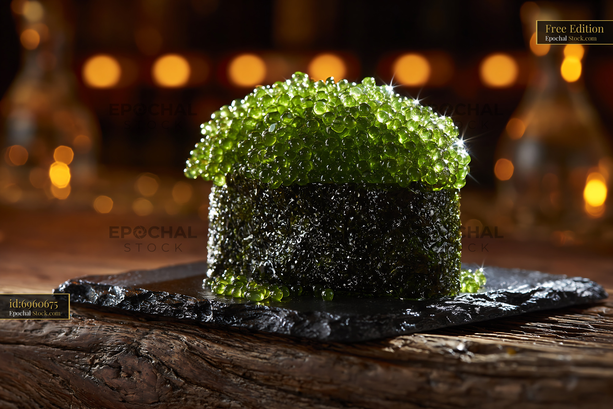 Fresh umi budo sushi with sparkling green sea grapes on a slate plate - stock photo