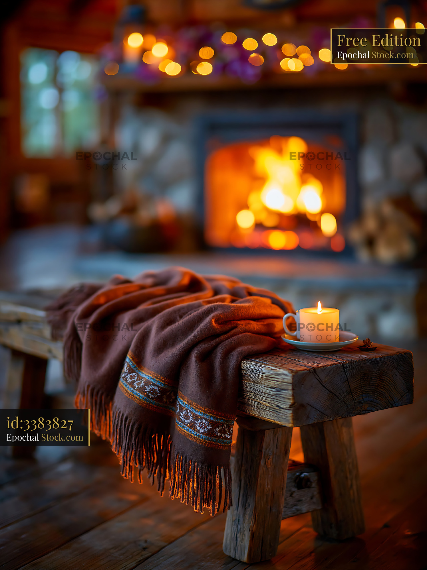 Brown wool blanket and candle on a rustic wooden bench by a fireplace - stock photo