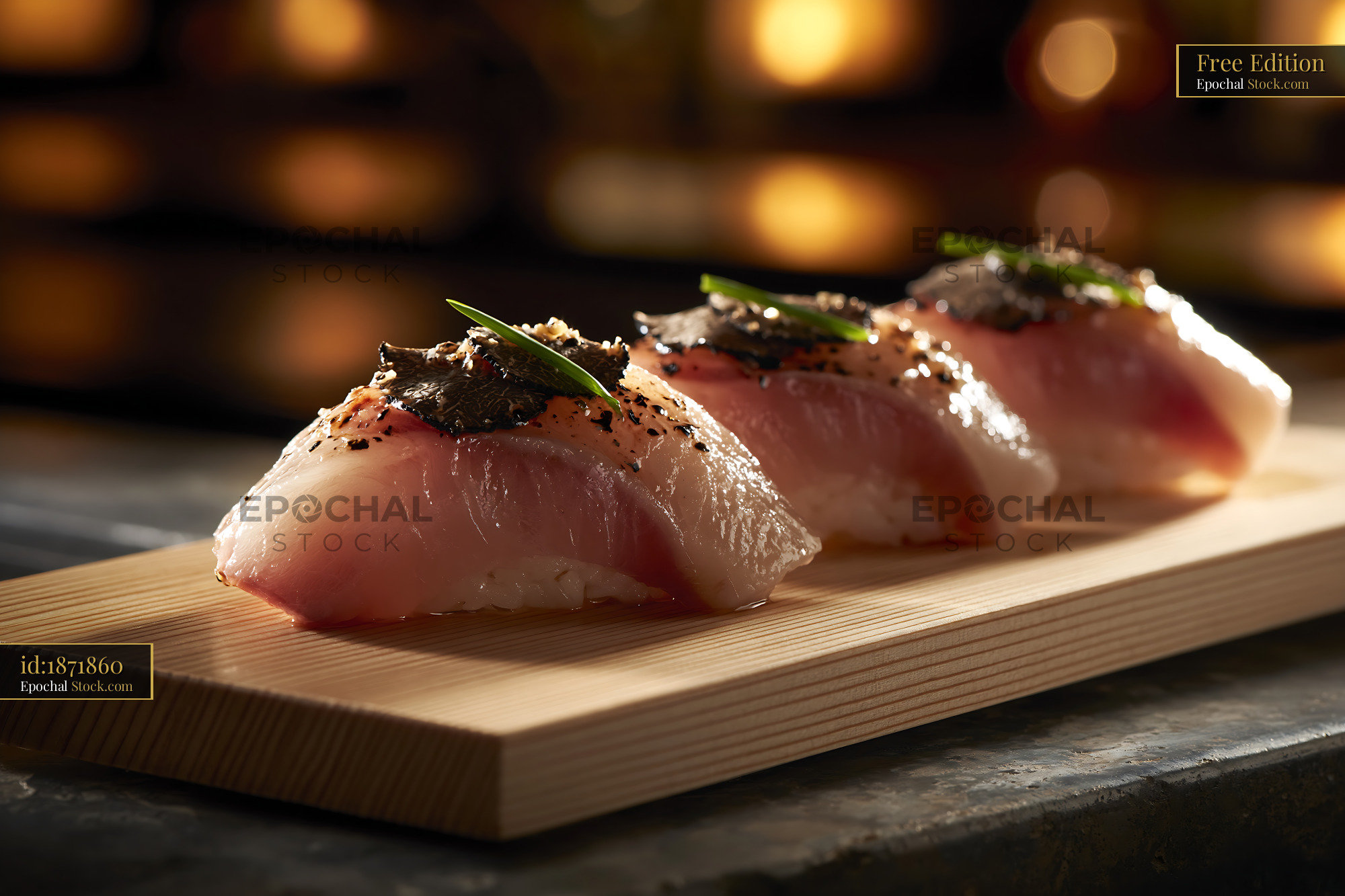 Gourmet yellowtail nigiri sushi topped with black truffle on wooden bo - stock photo