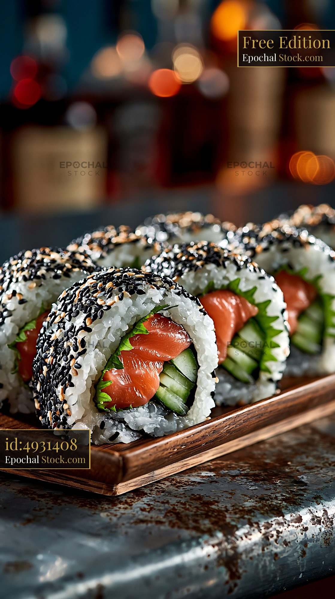 Shiso leaf uramaki sushi with fresh salmon and cucumber on wooden tray - stock photo