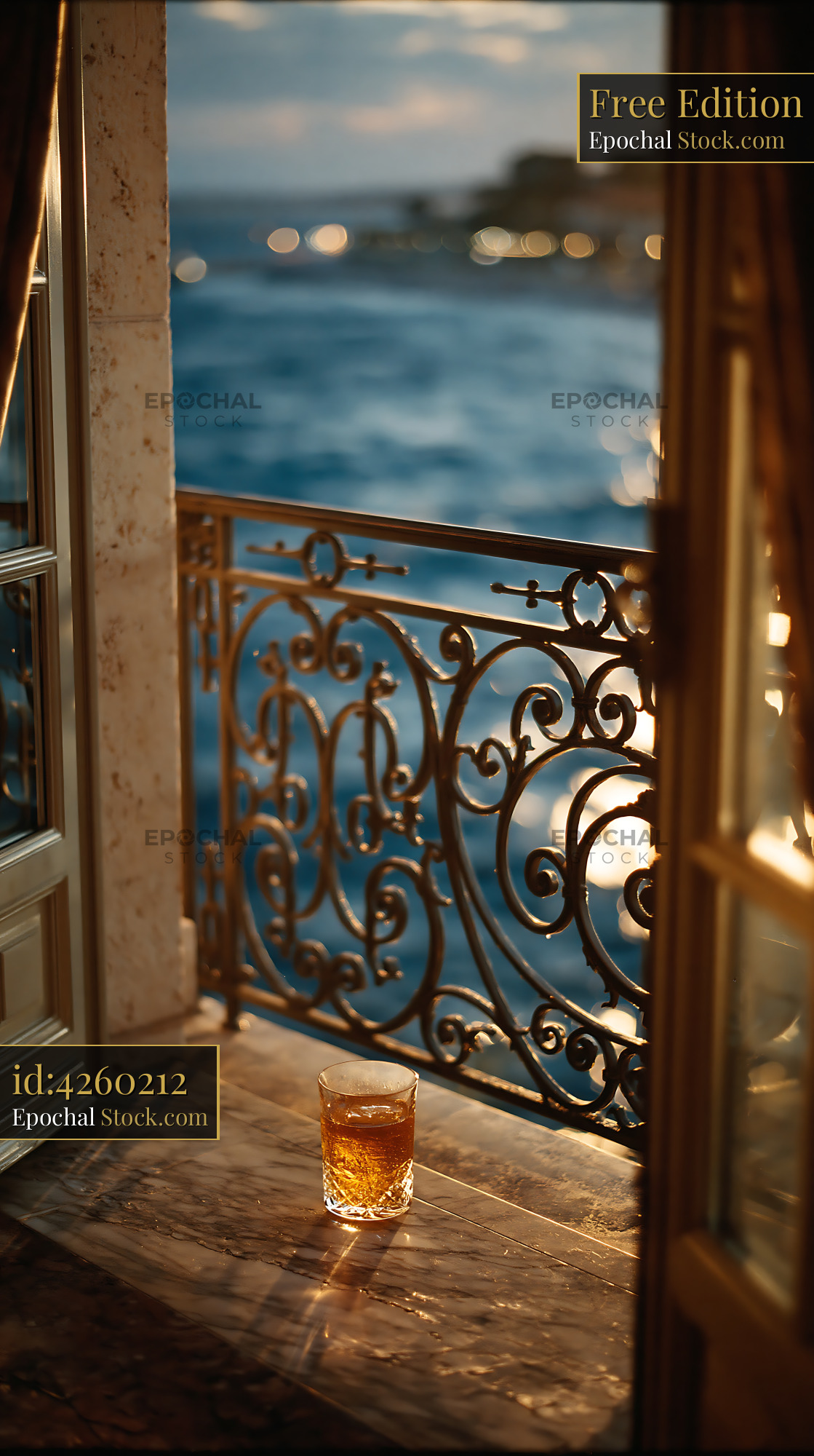 Glass of whiskey on marble balcony with luxury hotel balcony view - stock photo