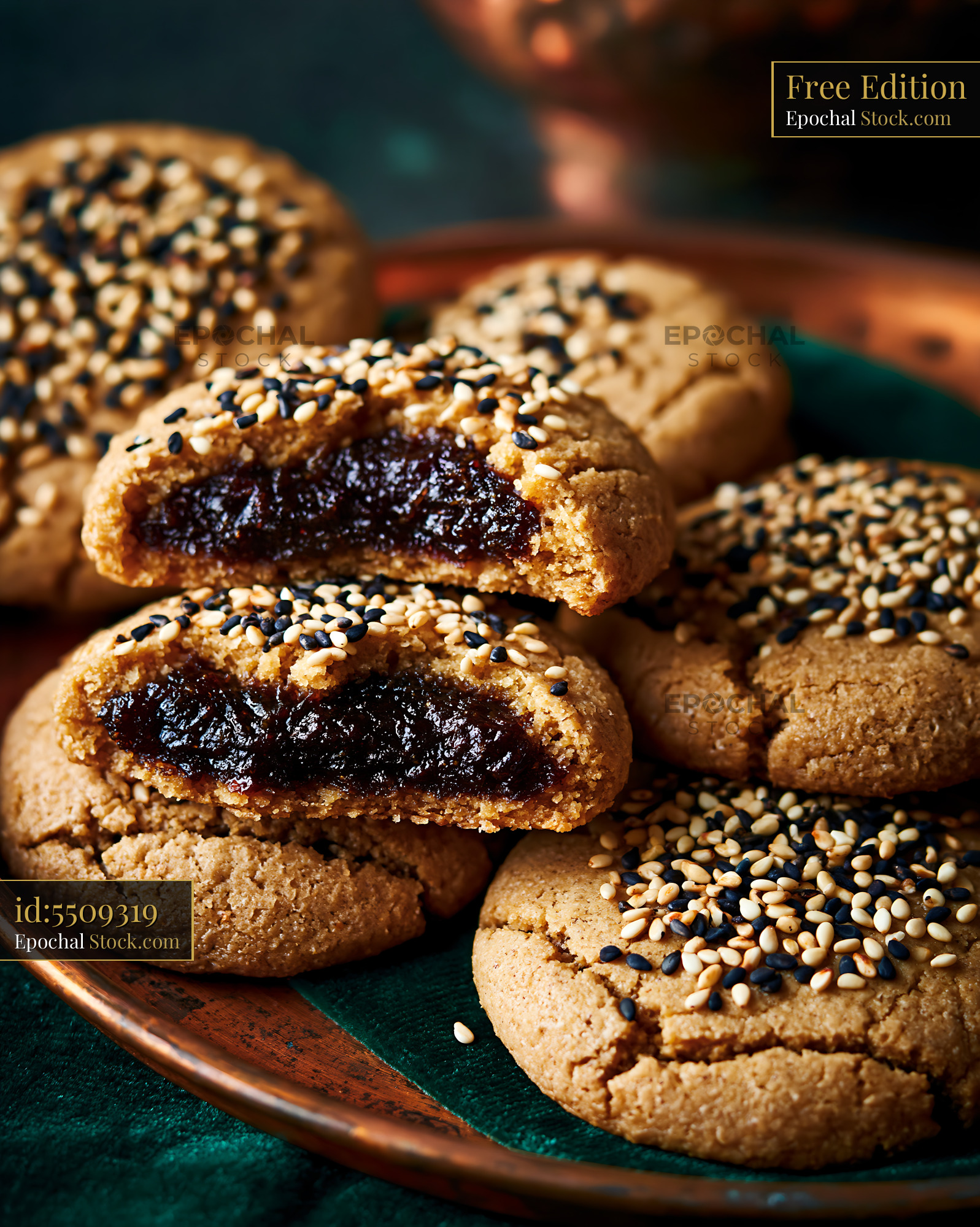 Tahini date biscuits with sesame seeds on a copper tray - stock photo