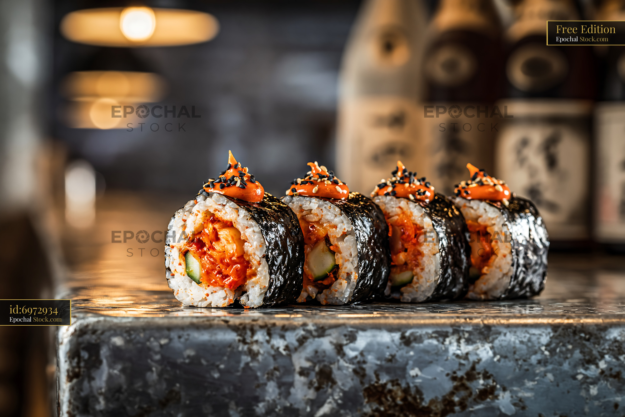 Kimchi fusion maki sushi rolls with spicy mayo on industrial counter - stock photo
