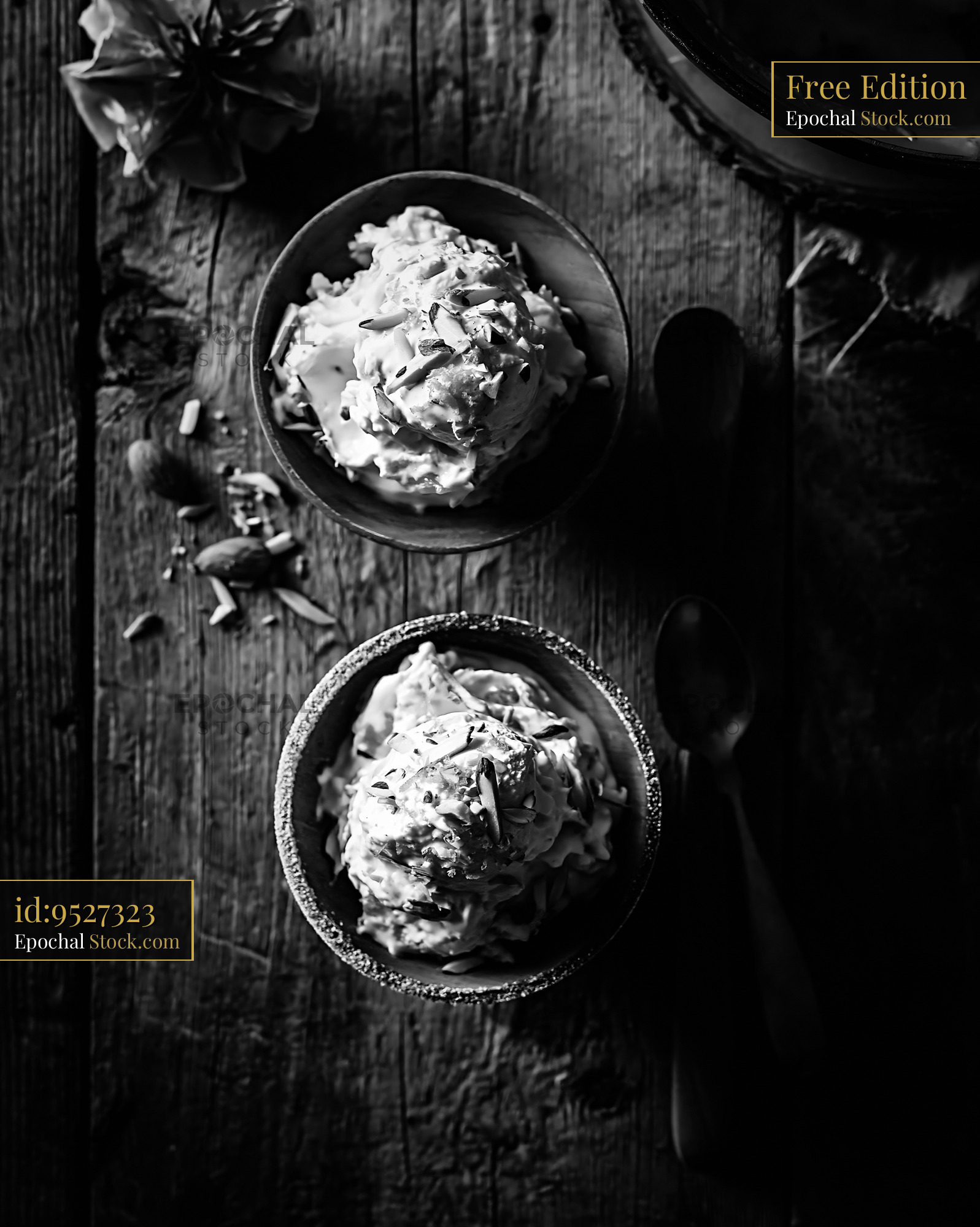 Amaretto di saronno ice cream with almond slivers in rustic bowls - stock photo