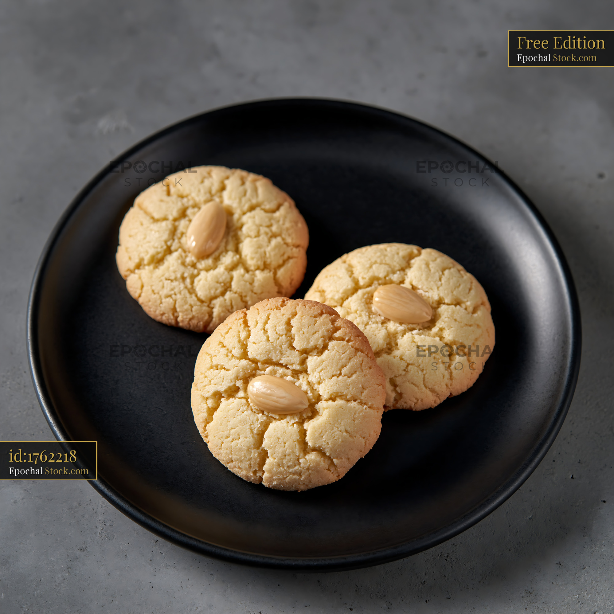 Fresh acibadem kurabiyesi biscuits on a minimalist black plate - stock photo