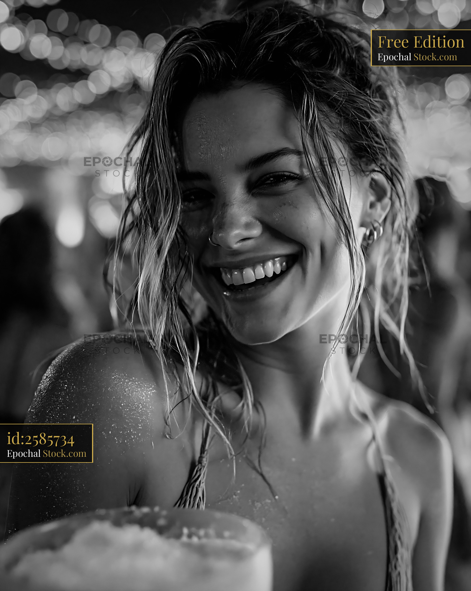 Happy young woman with wet hair enjoying prosecco ice cream - stock photo