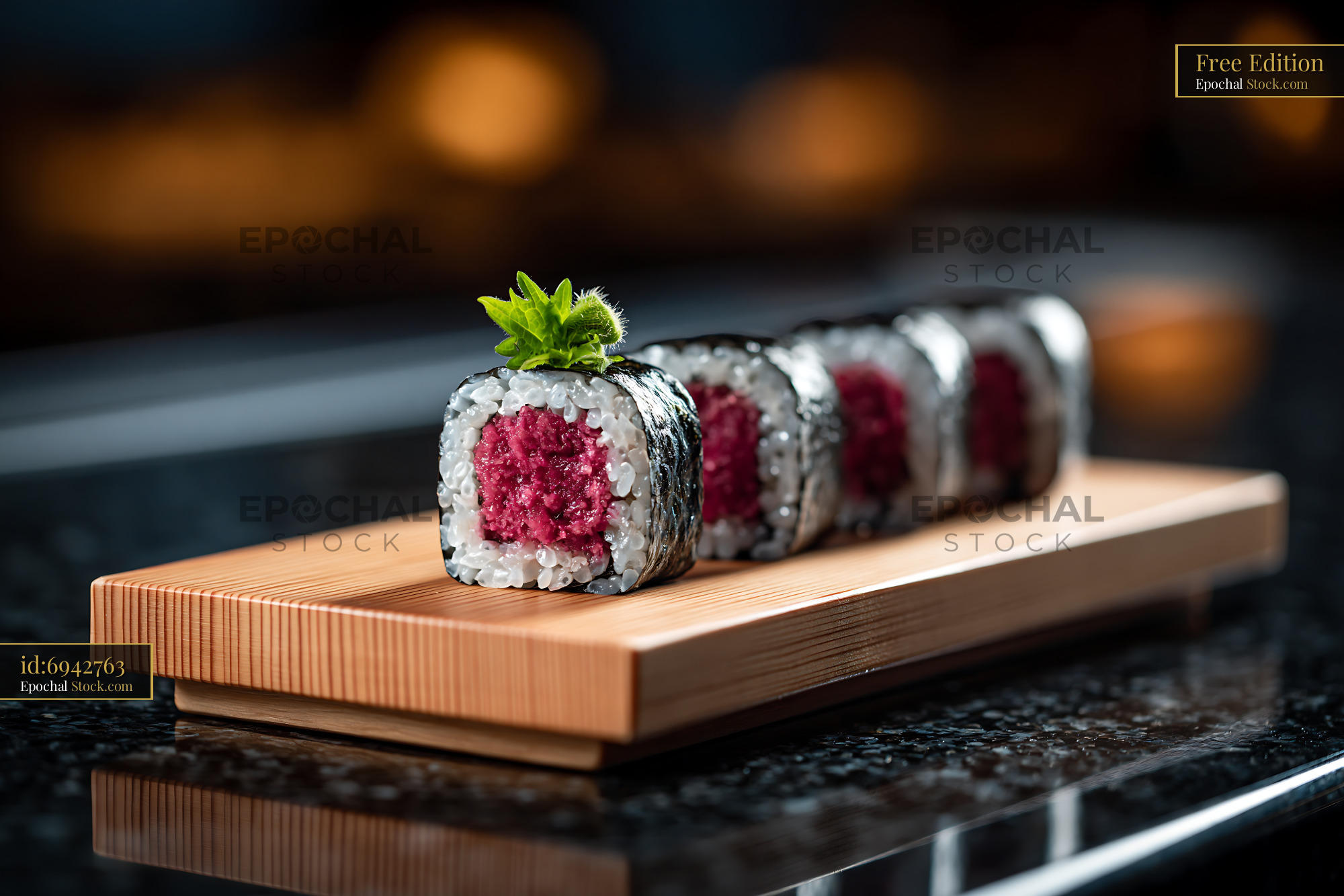 Salted plum umeboshi sushi rolls on a traditional wooden geta board - stock photo