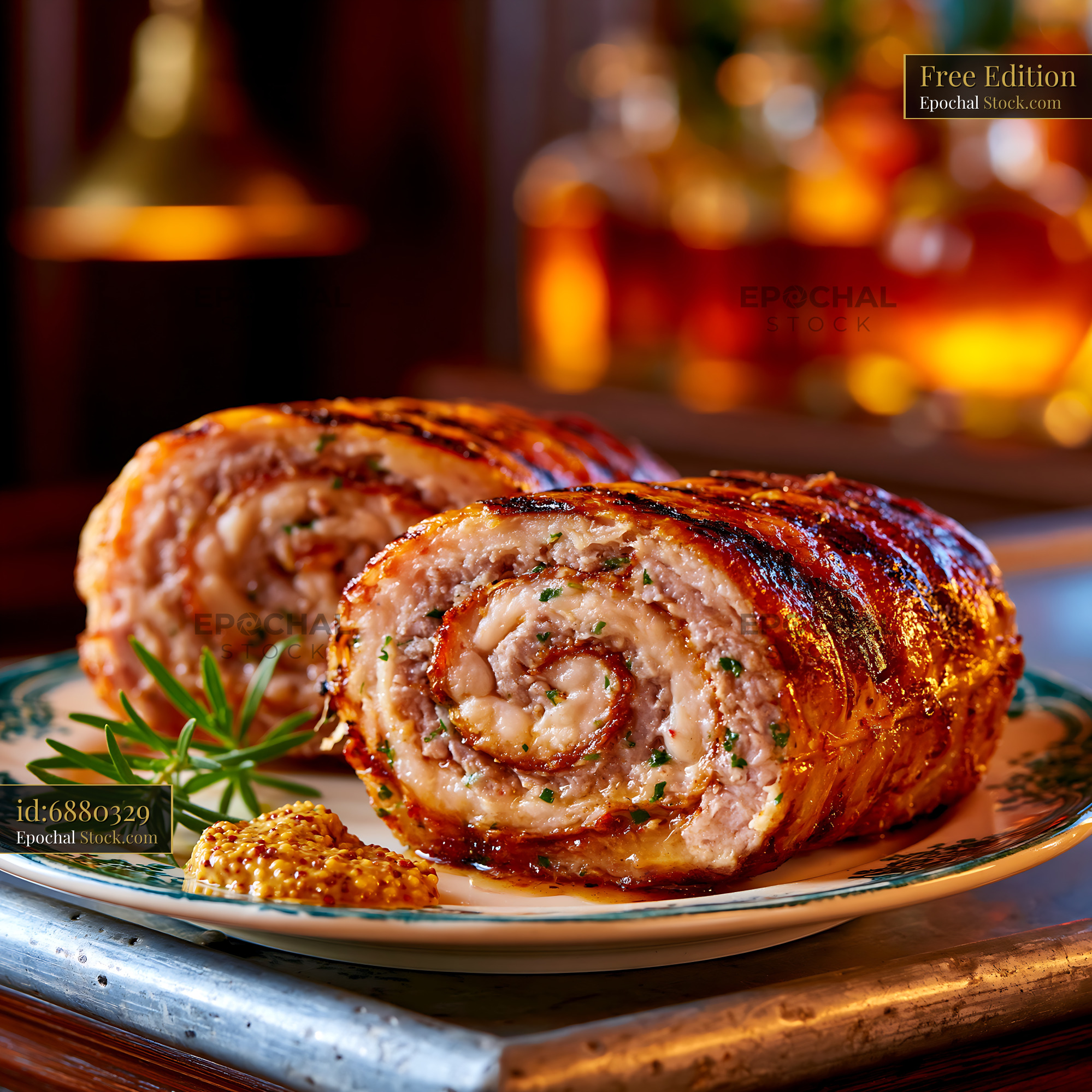 French andouillette de troyes meat rolls served on a rustic plate - stock photo