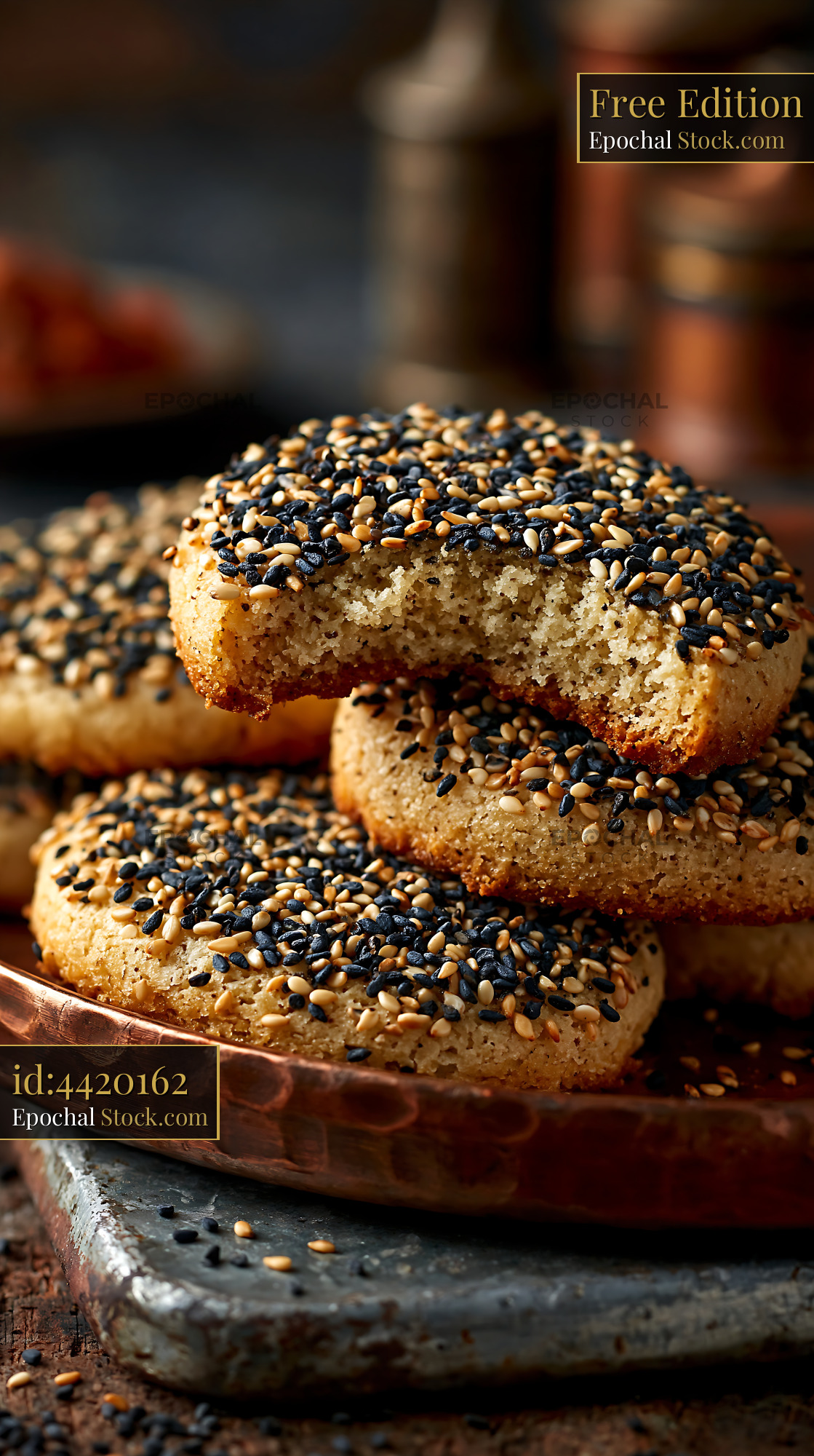Stack of homemade mahlab spice biscuits on a rustic copper plate - stock photo