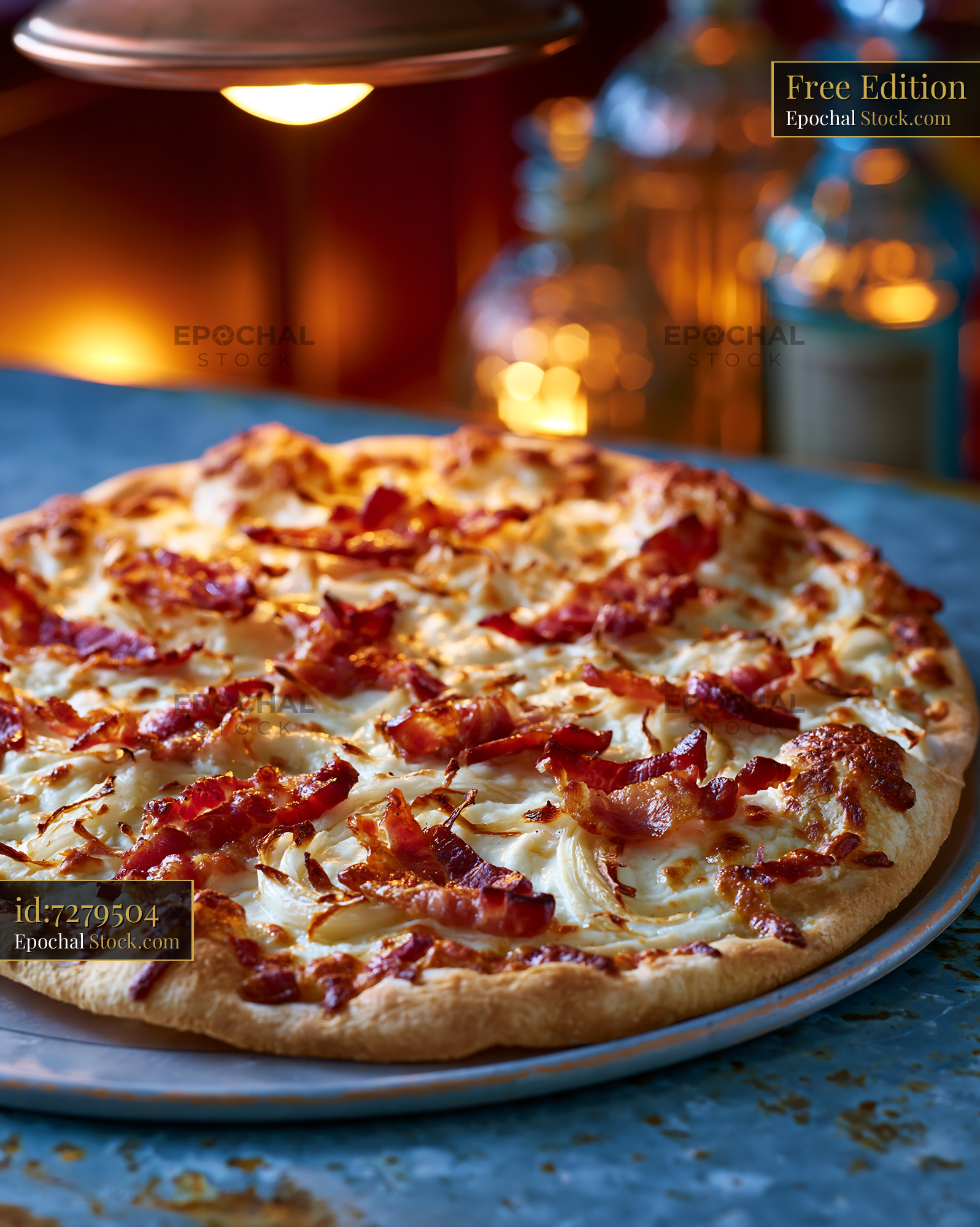 Tarte flambee pizza with crispy bacon and onions in warm restaurant li - stock photo