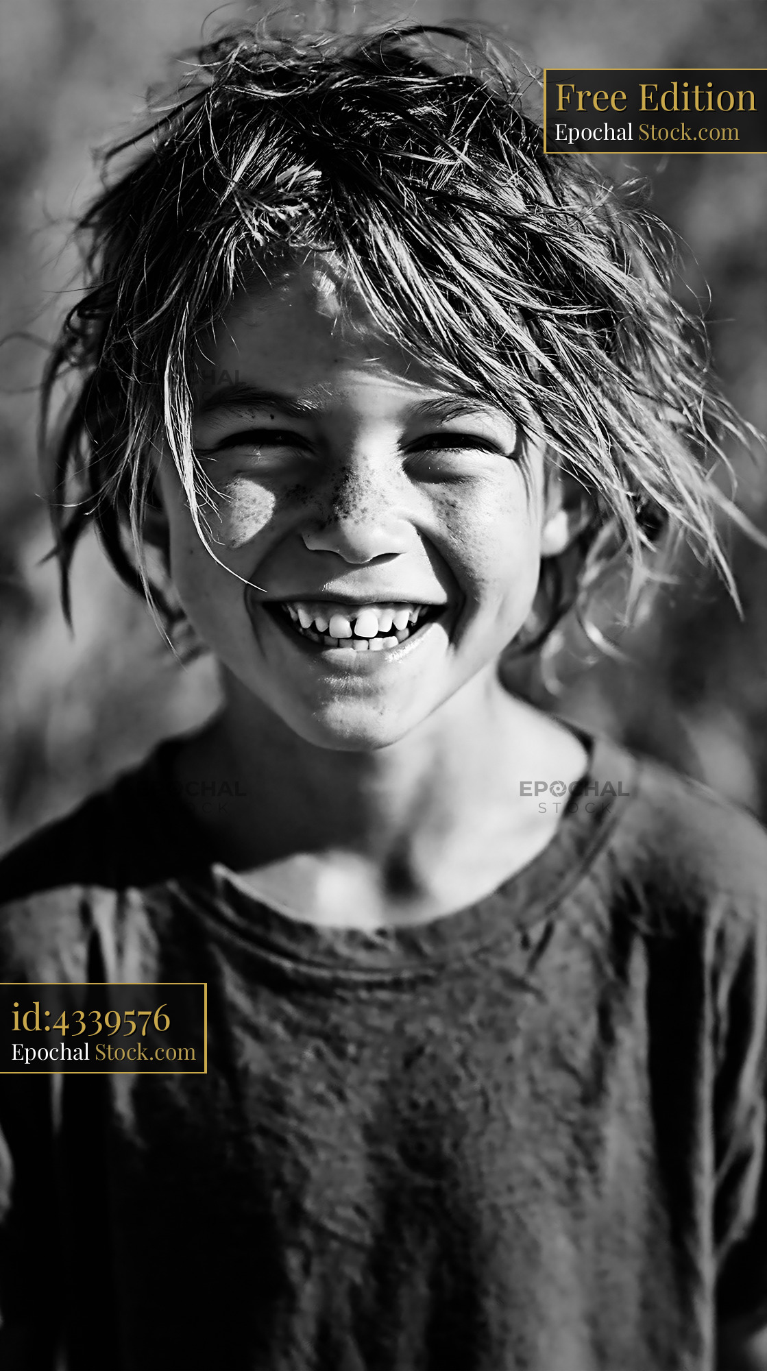 Happy young boy with messy hair smiling and showing missing tooth - stock photo