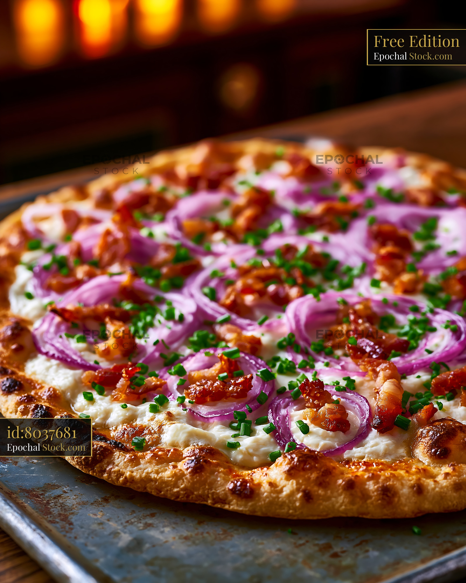Freshly baked flammkuchen pizza with red onions bacon and chives - stock photo