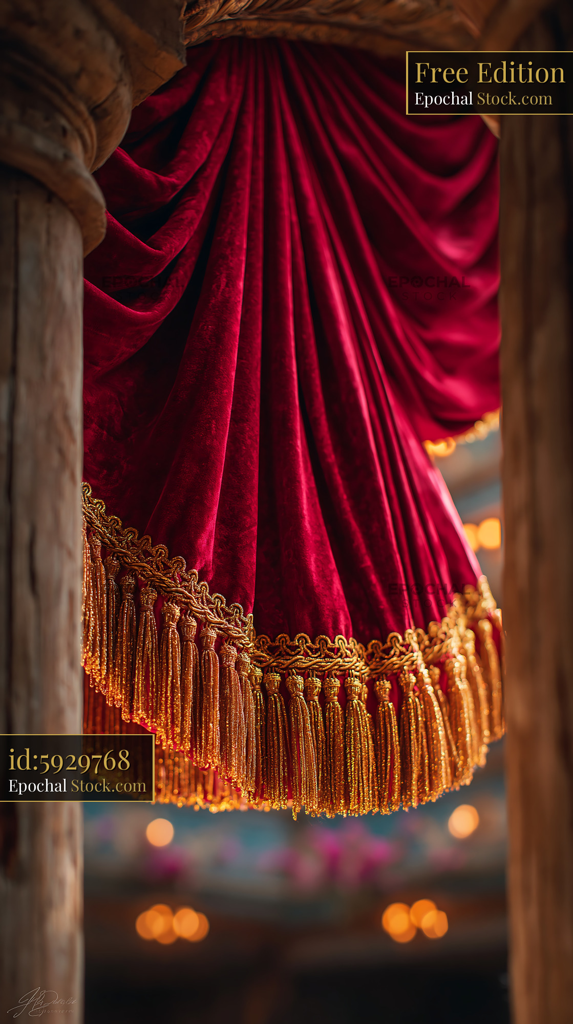Luxurious red velvet stage curtain with gold fringe and tassels