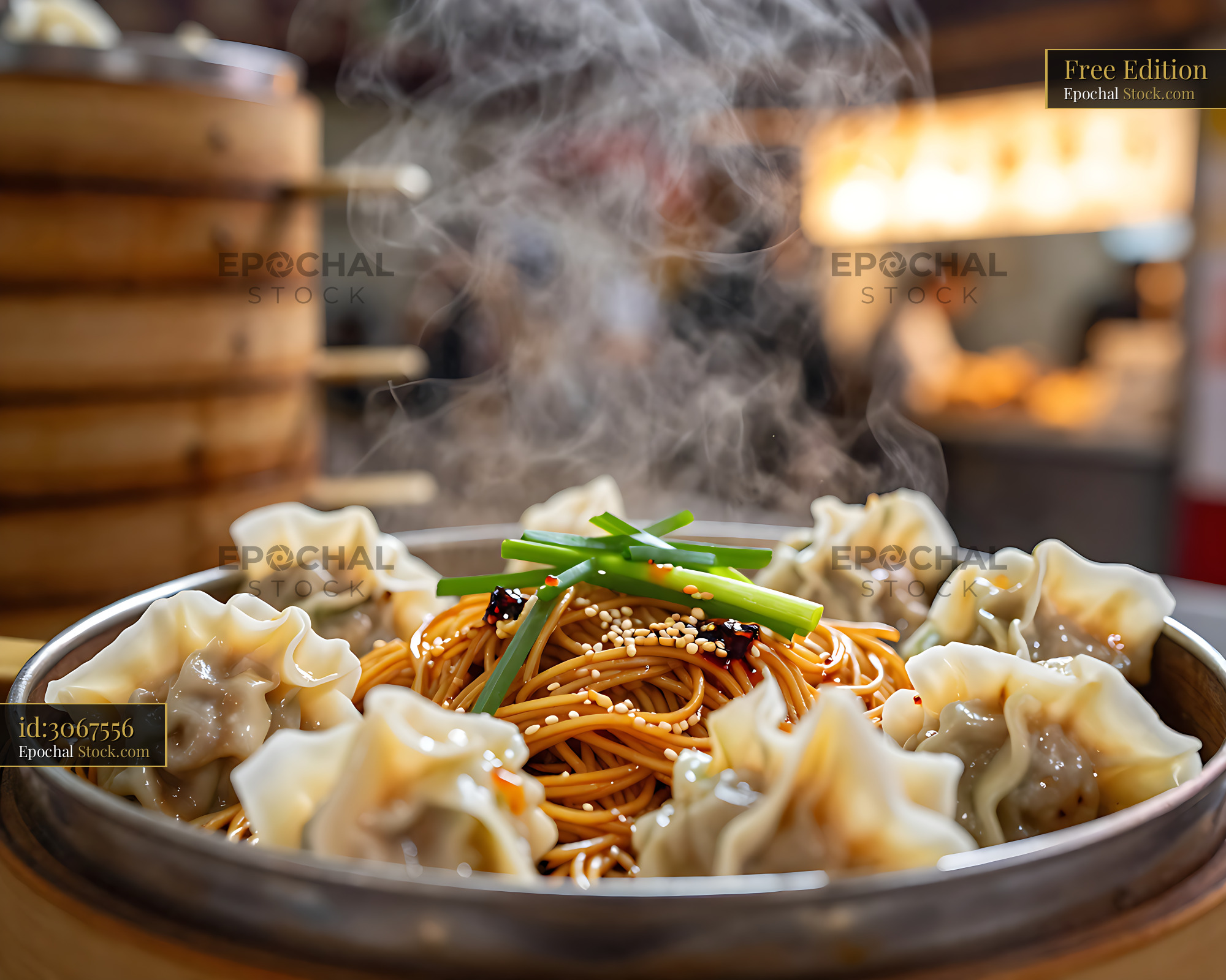 Steaming hot zhu sheng yun tun mian with wontons in a bamboo steamer - stock photo