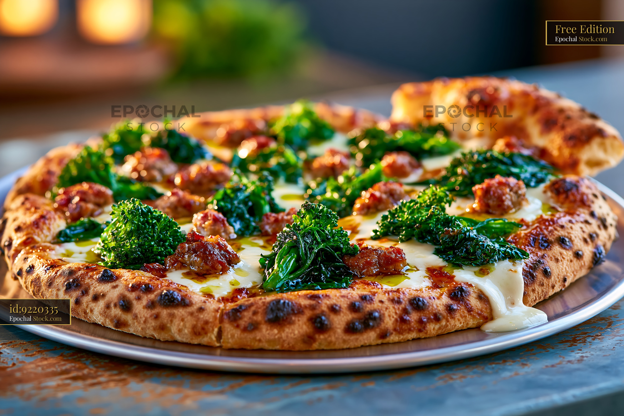 Neapolitan friarielli sausage pizza with charred crust on metal tray - stock photo
