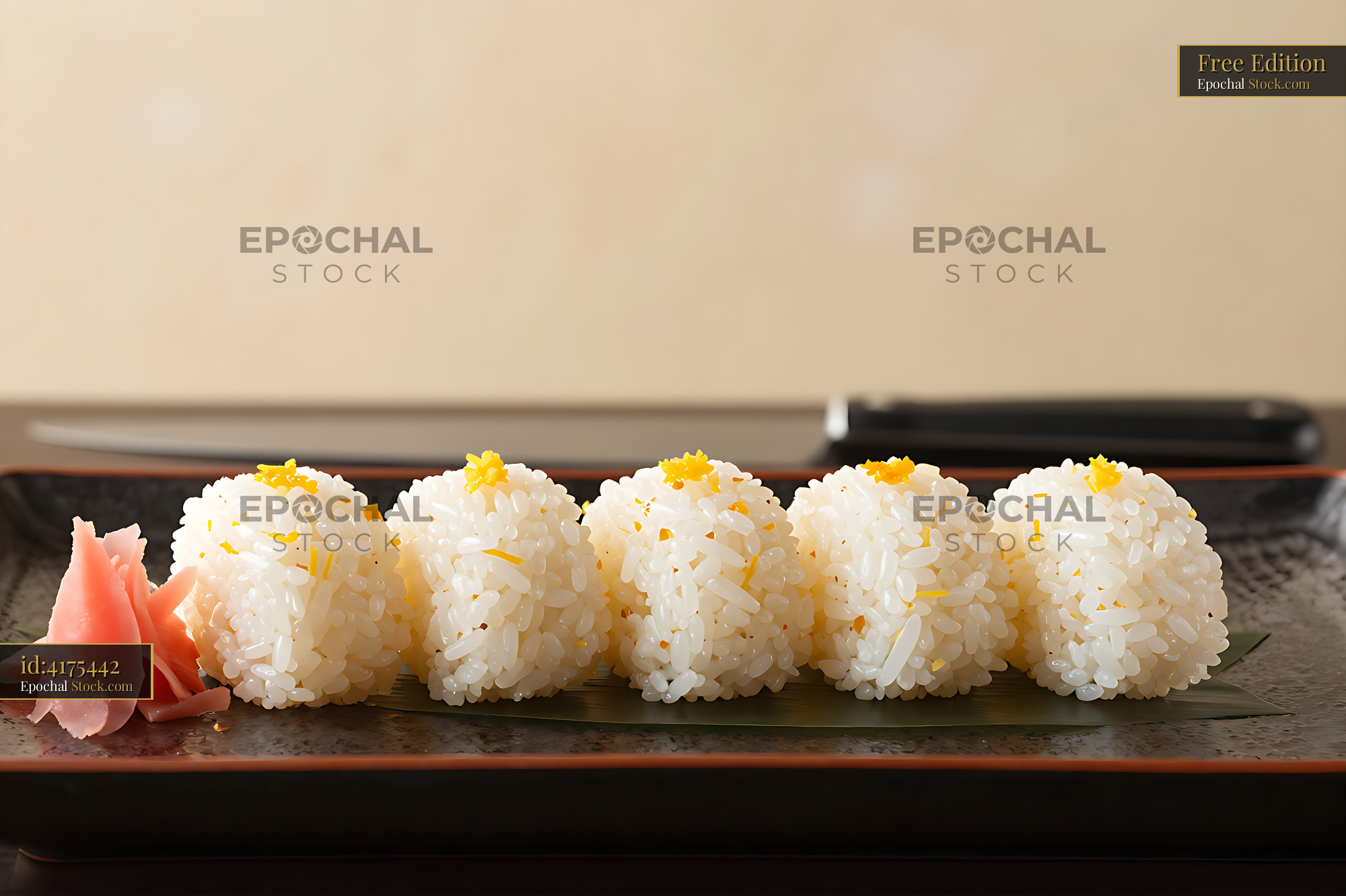 Five fresh yuzu inari rice balls served with pickled ginger - stock photo