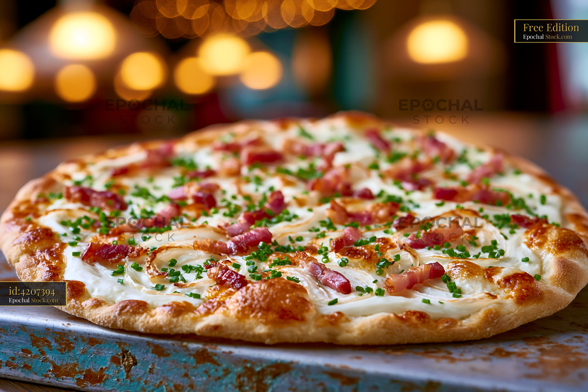 Traditional flammkuchen pizza with crispy bacon and fresh chives - stock photo