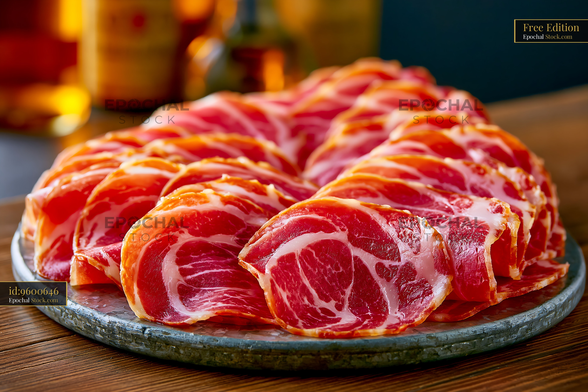 Sliced culatello di zibello meat on a rustic slate platter - stock photo