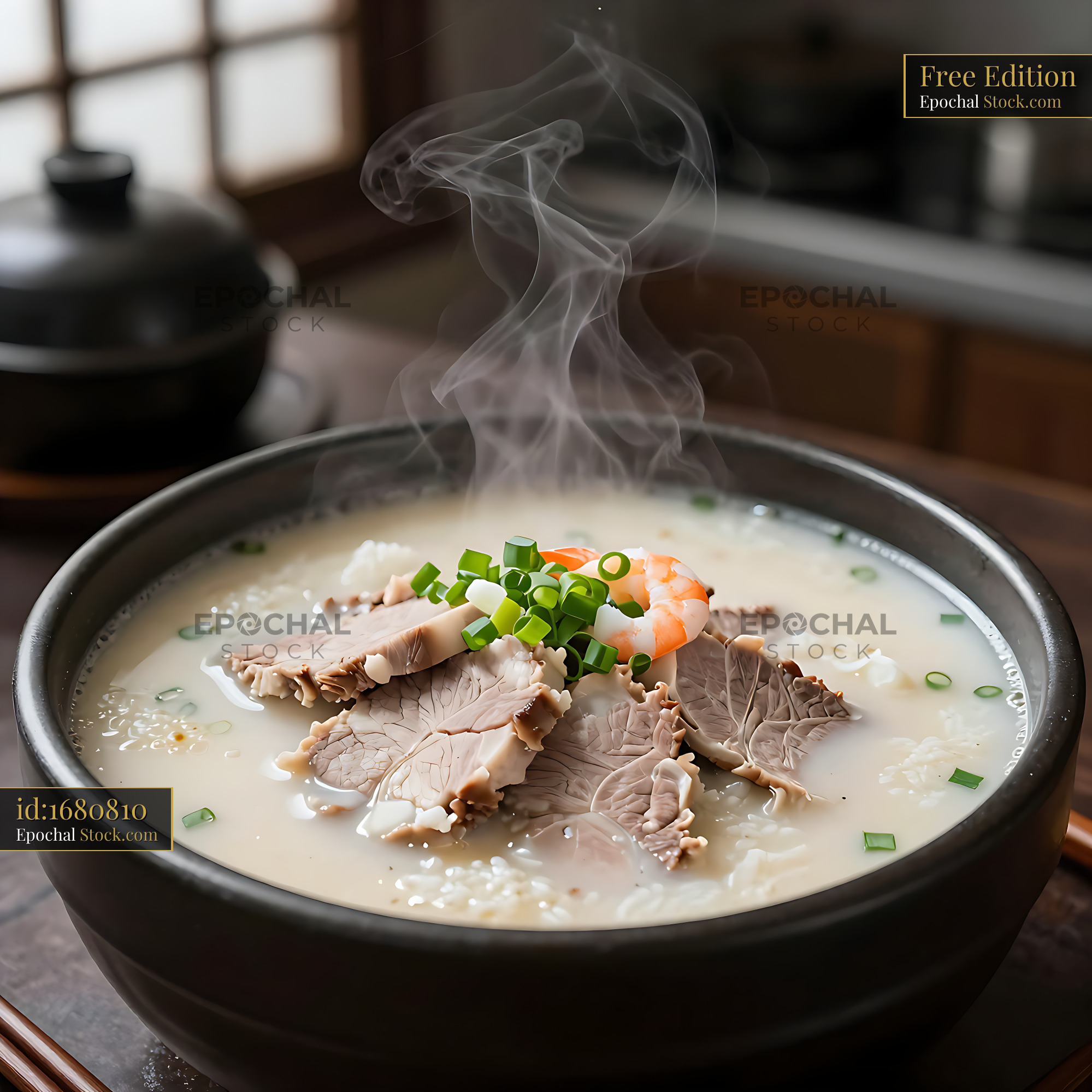 Steaming bowl of Busan Dwaeji Gukbap pork rice soup with shrimp - stock photo