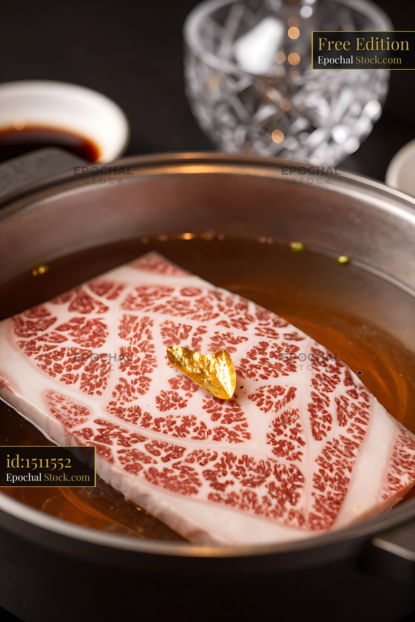 Premium A5 Wagyu beef with gold leaf in a hot pot broth - stock photo