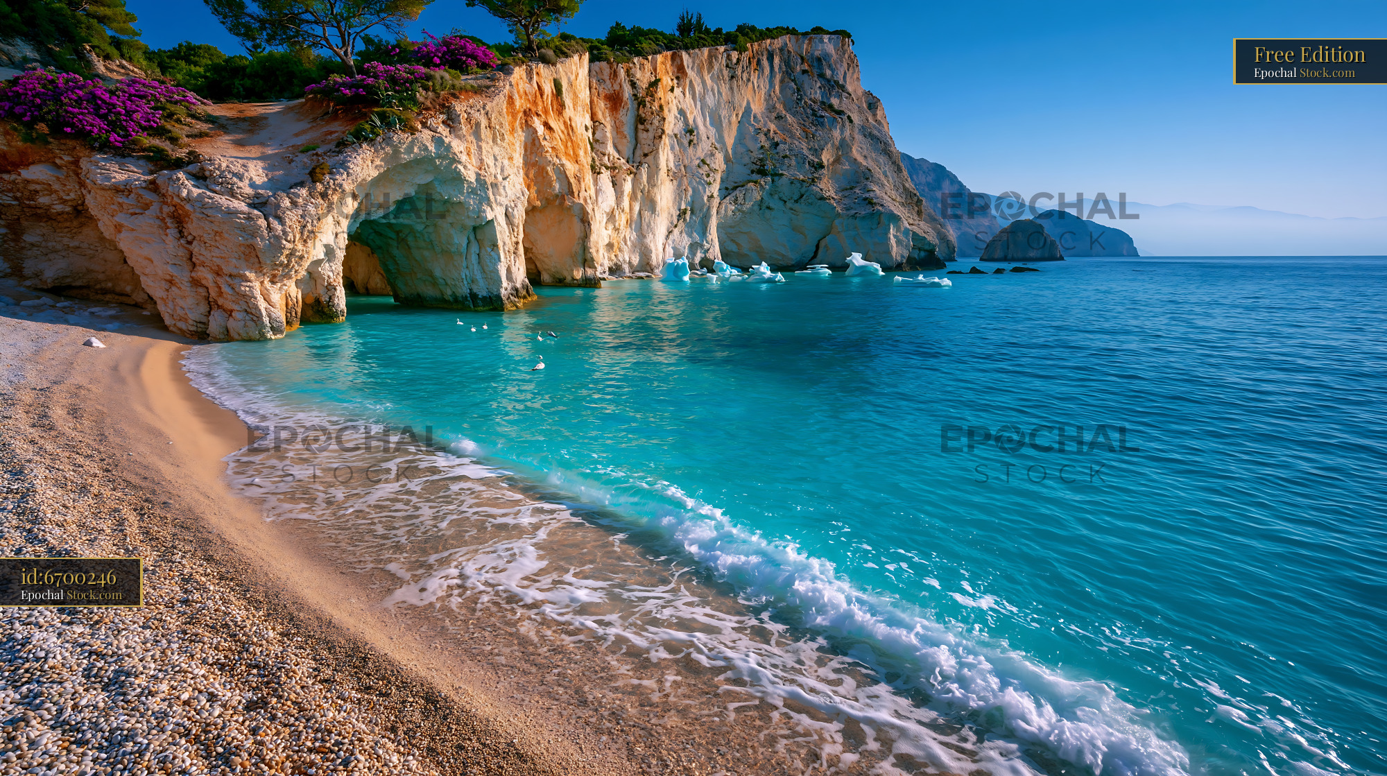 Pristine beach with white cliffs and sea cave in turquoise water - stock photo