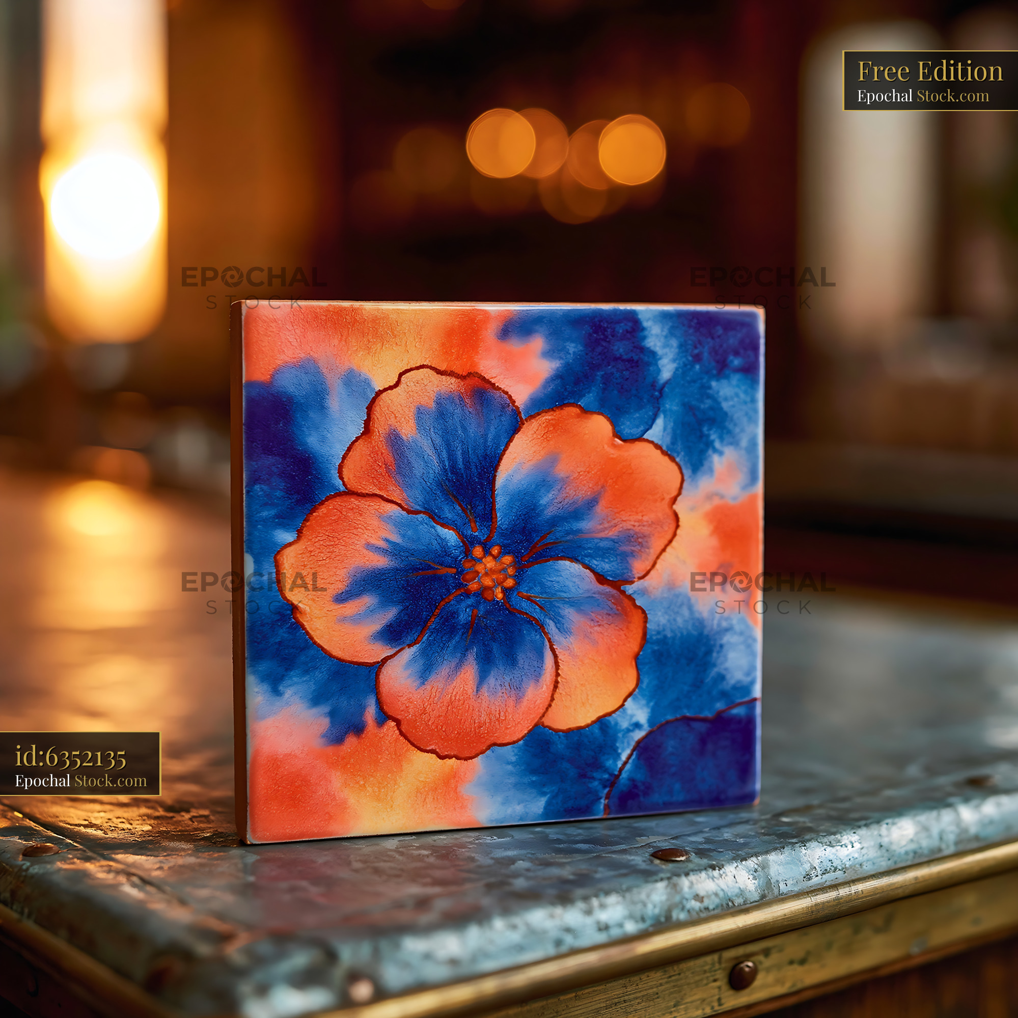 Handmade ceramic tile with vibrant floral painting on rustic metal - stock photo