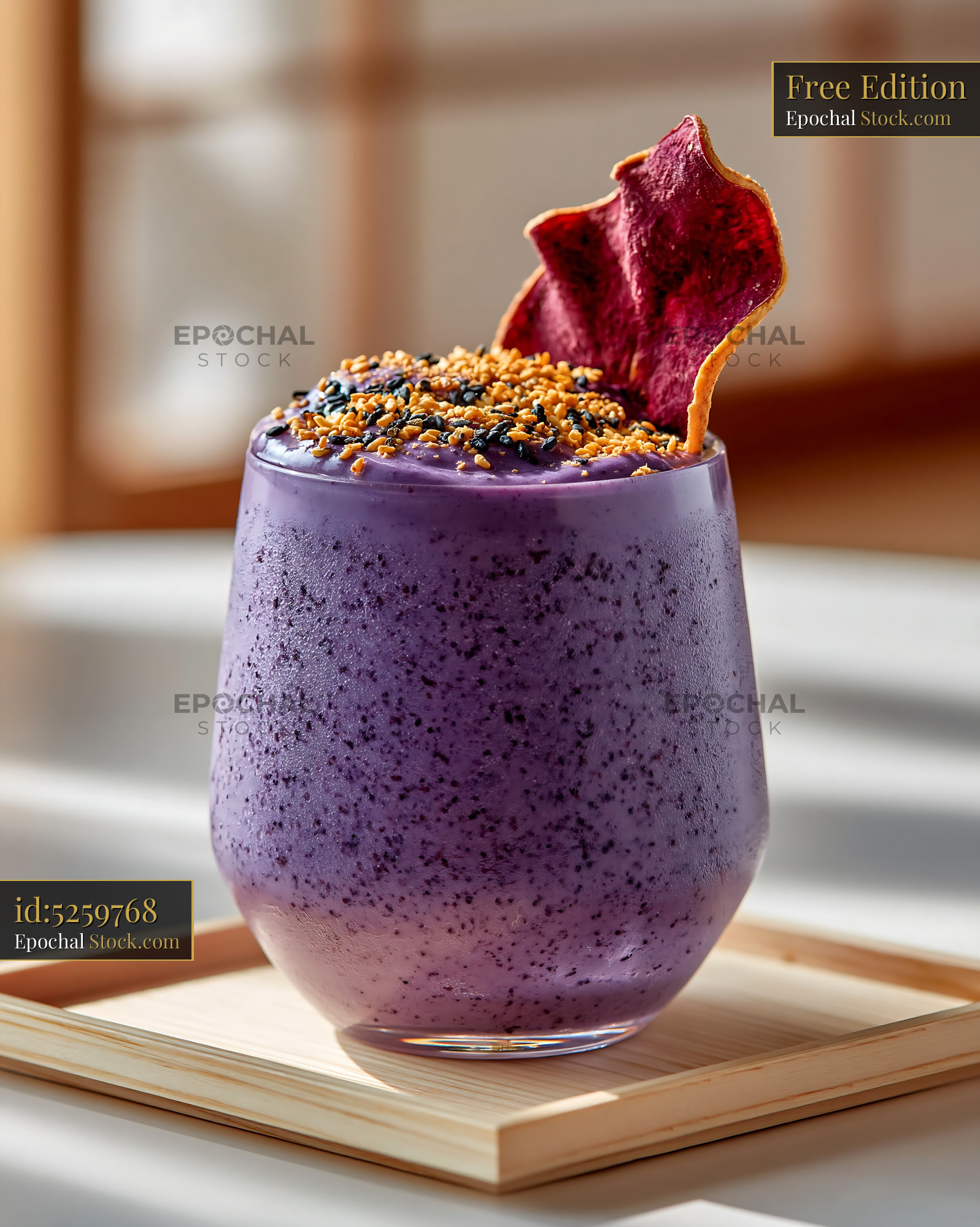 Creamy beni imo smoothie topped with sesame seeds and a sweet potato c - stock photo