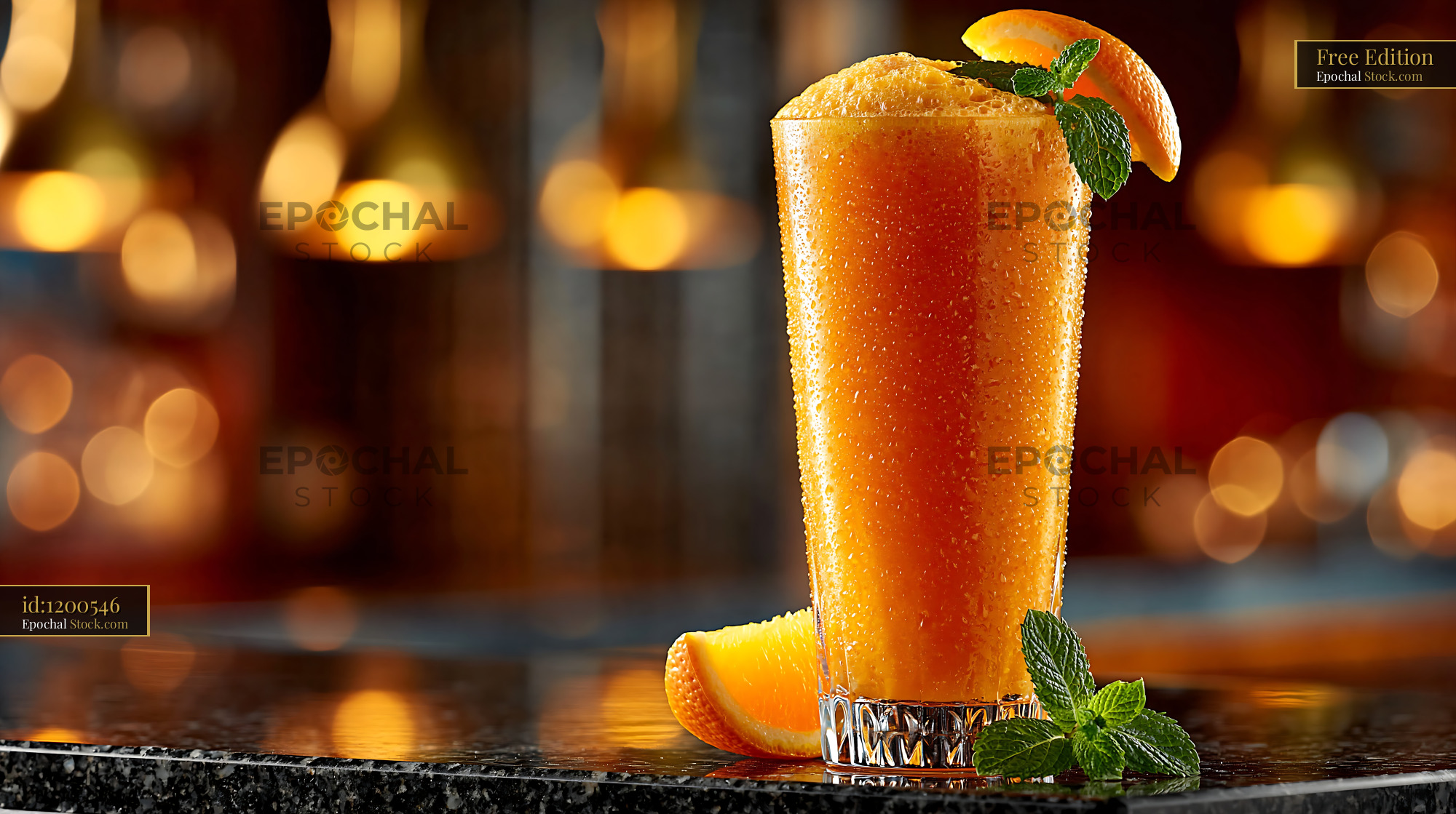 Hallabong citrus smoothie with fresh mint and orange garnish on a bar - stock photo
