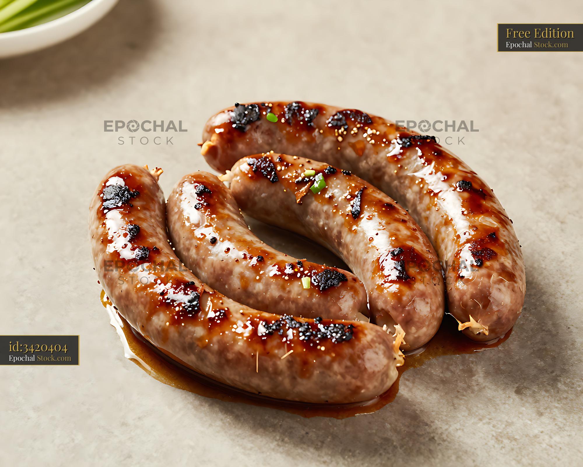 Grilled Northern Thai Sai Ua sausages on a stone surface - stock photo