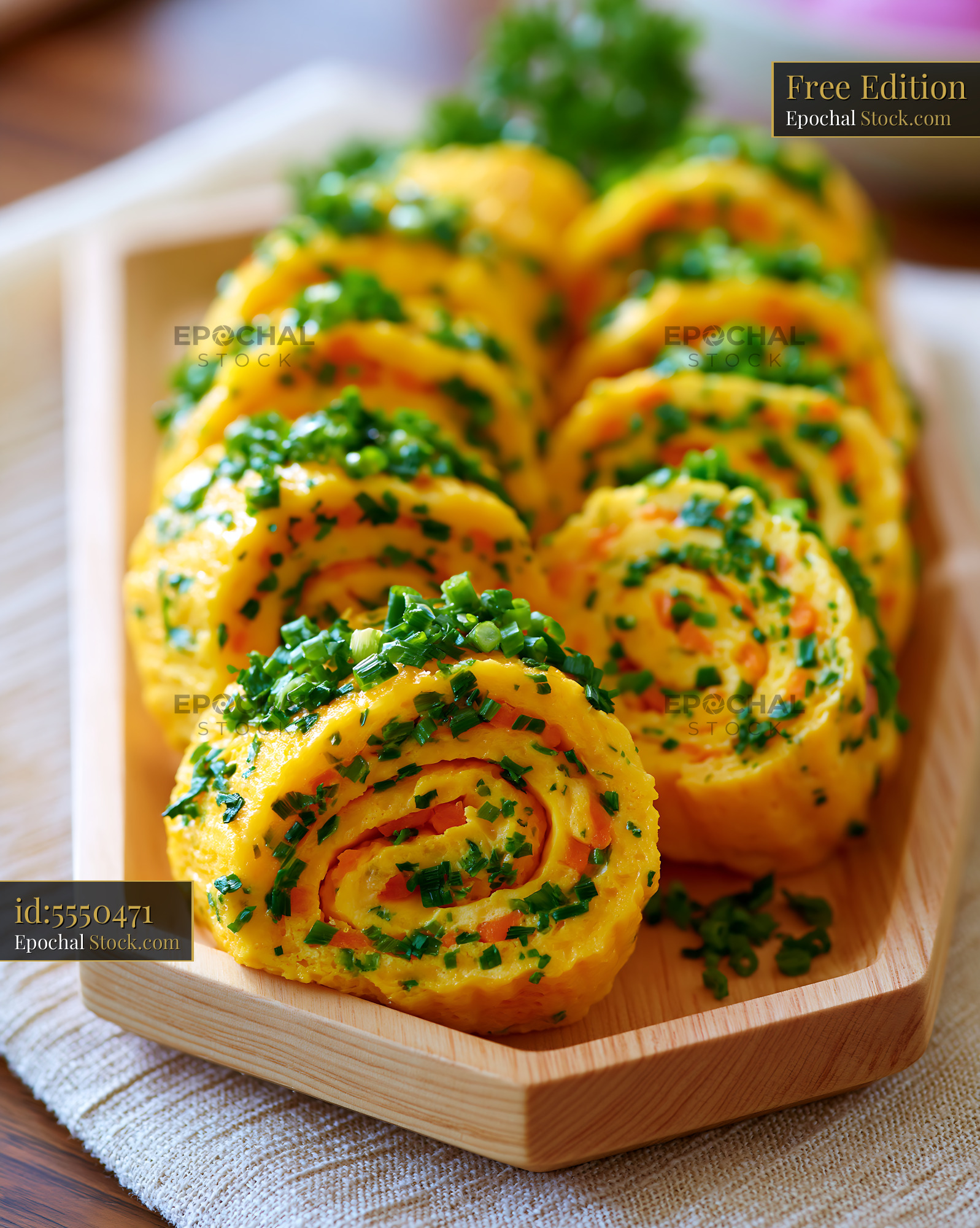 Korean rolled omelette gyeran mari with fresh chives and carrots - stock photo