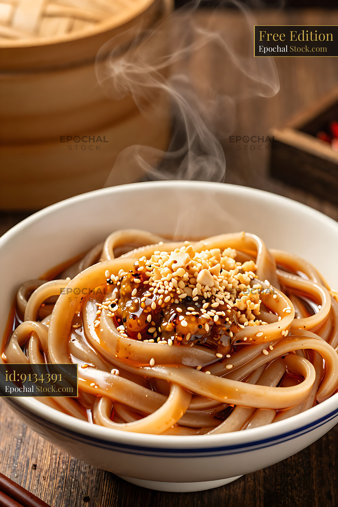 Steaming bowl of Tianshui Mian with spicy sauce and sesame seeds - stock photo