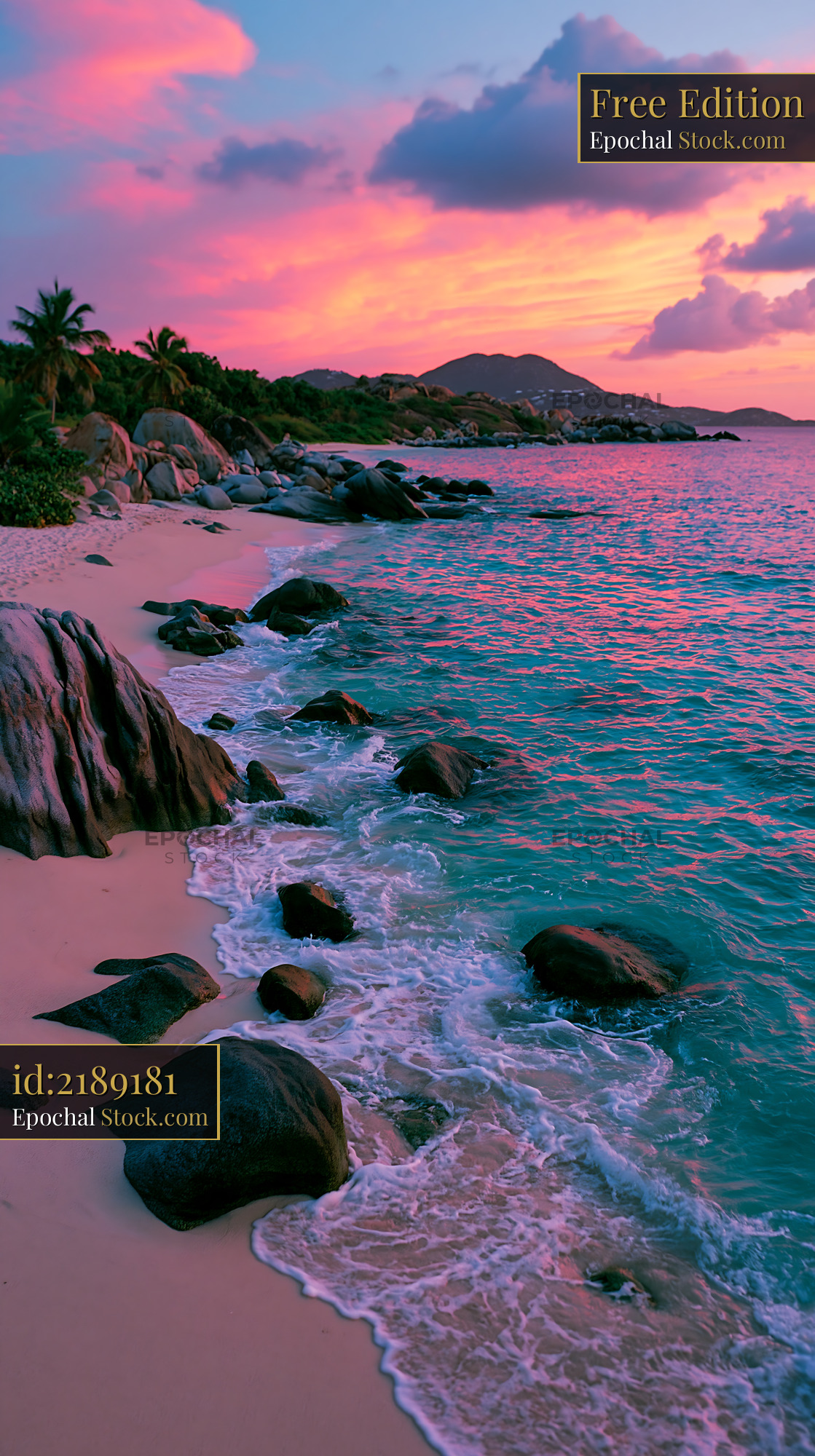 Tropical beach with granite boulders and vibrant pink sunset - stock photo
