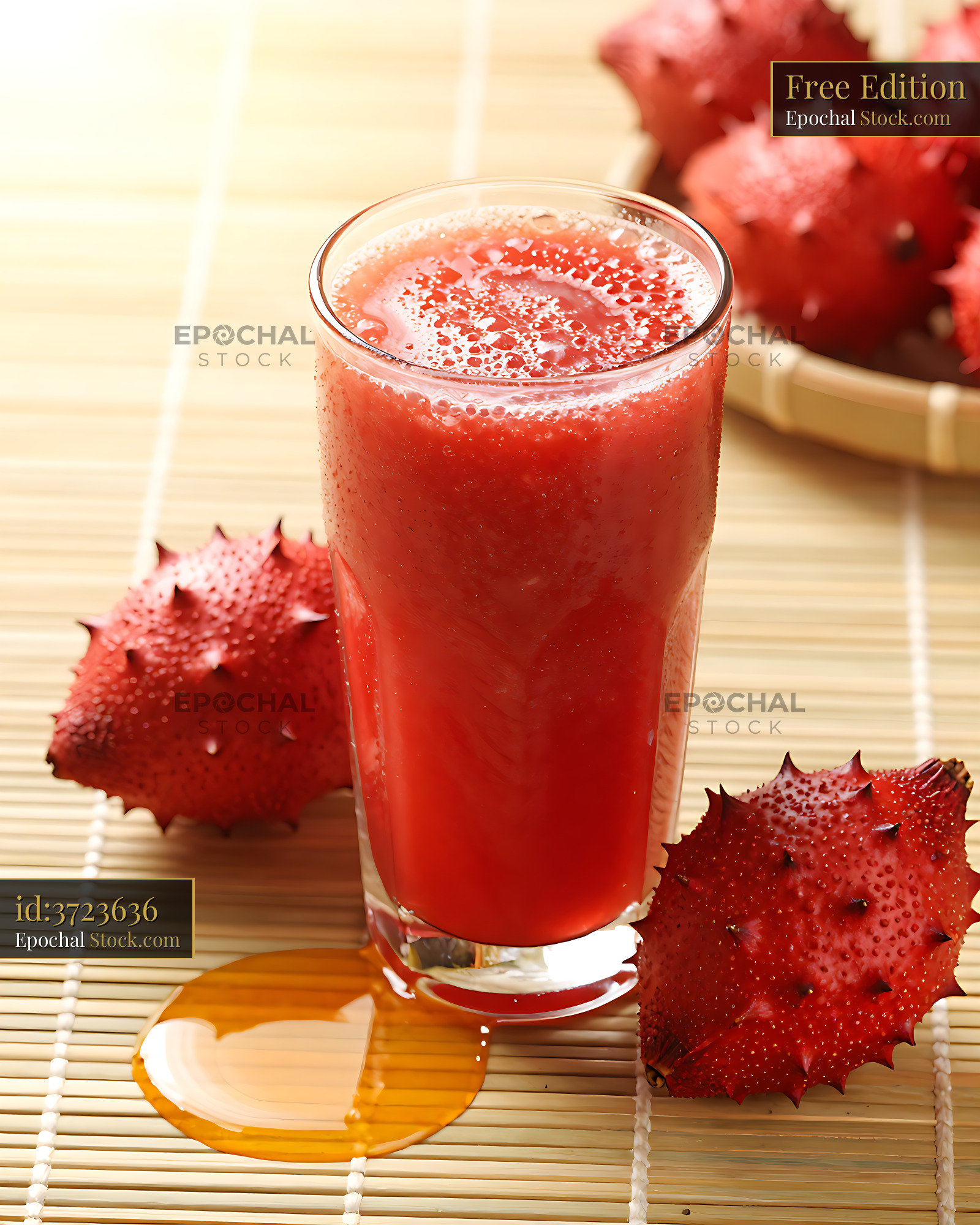 Gac Garden smoothie in a glass with fresh exotic fruit on bamboo mat - stock photo