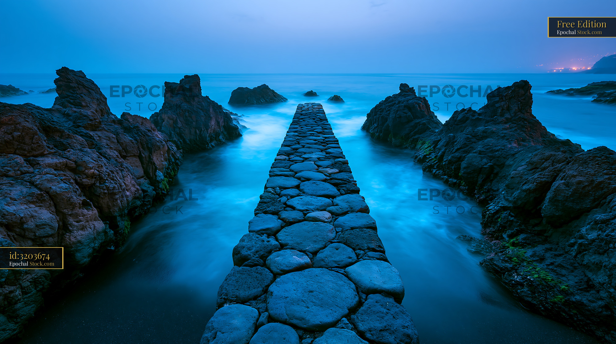 Stone pier leading into the ocean at Los Cancajos coves in La Palma - stock photo