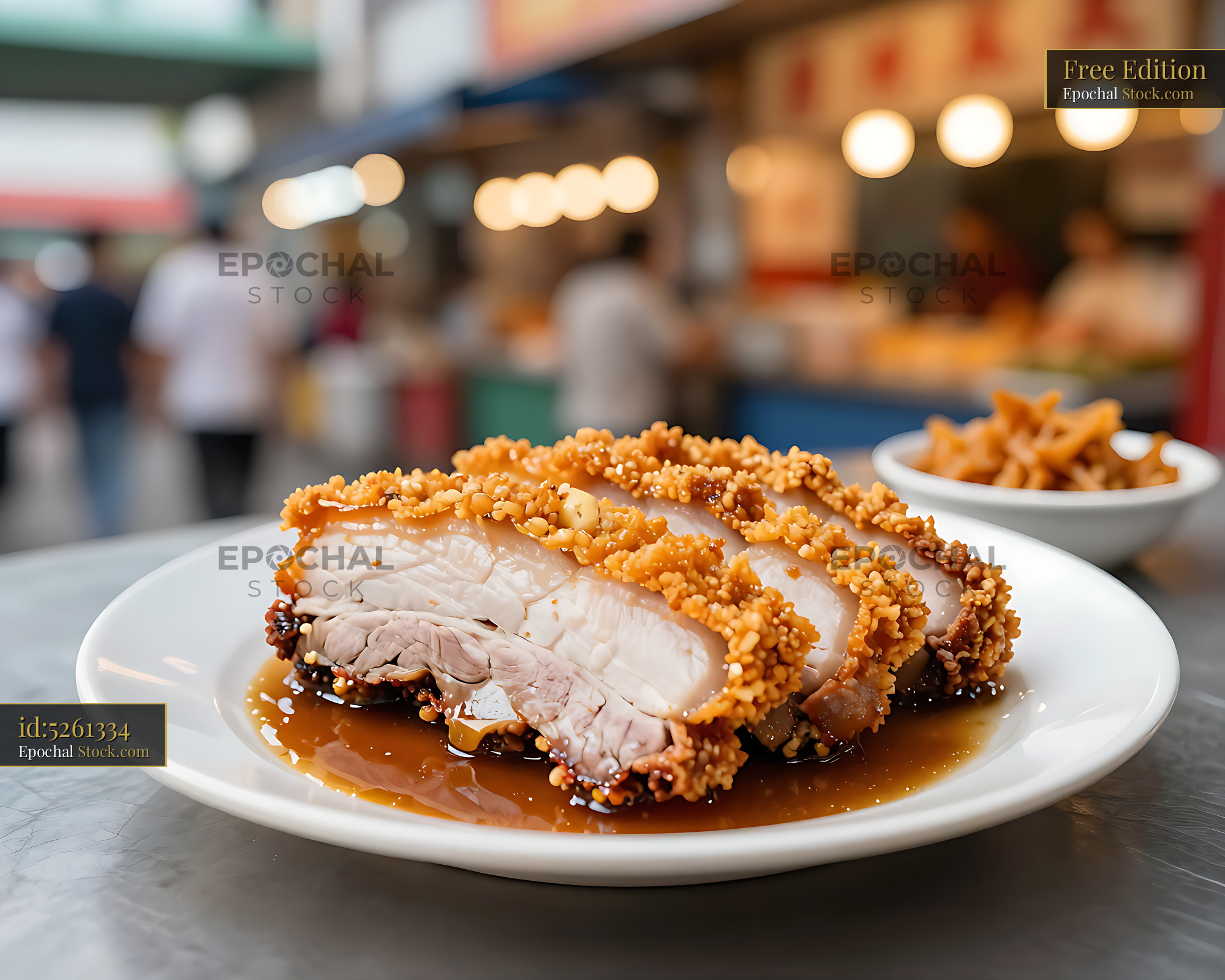 Crispy Ilocos bagnet pork belly slices served at a street food market - stock photo