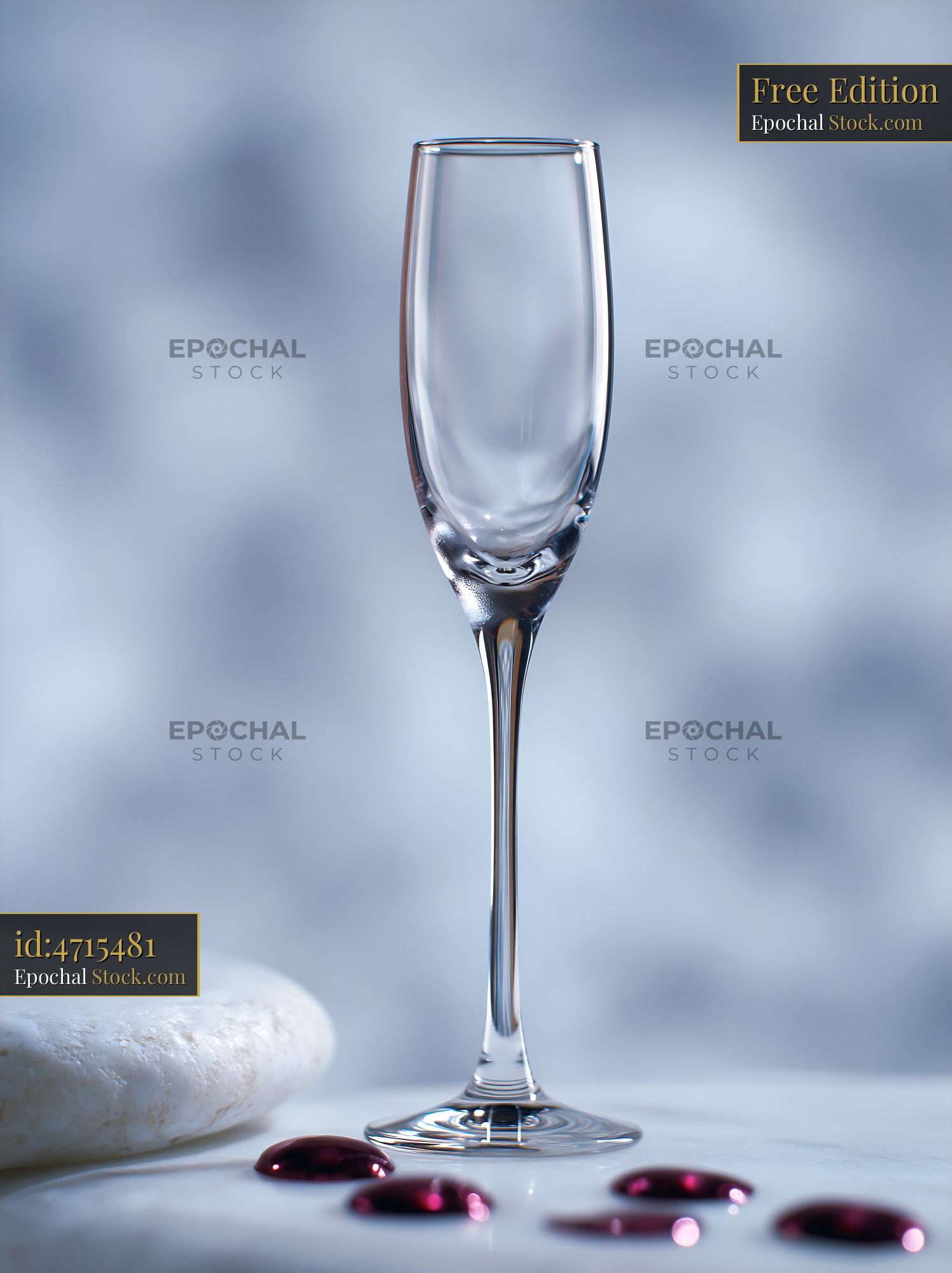 Empty champagne flute at midnight on white marble surface - stock photo