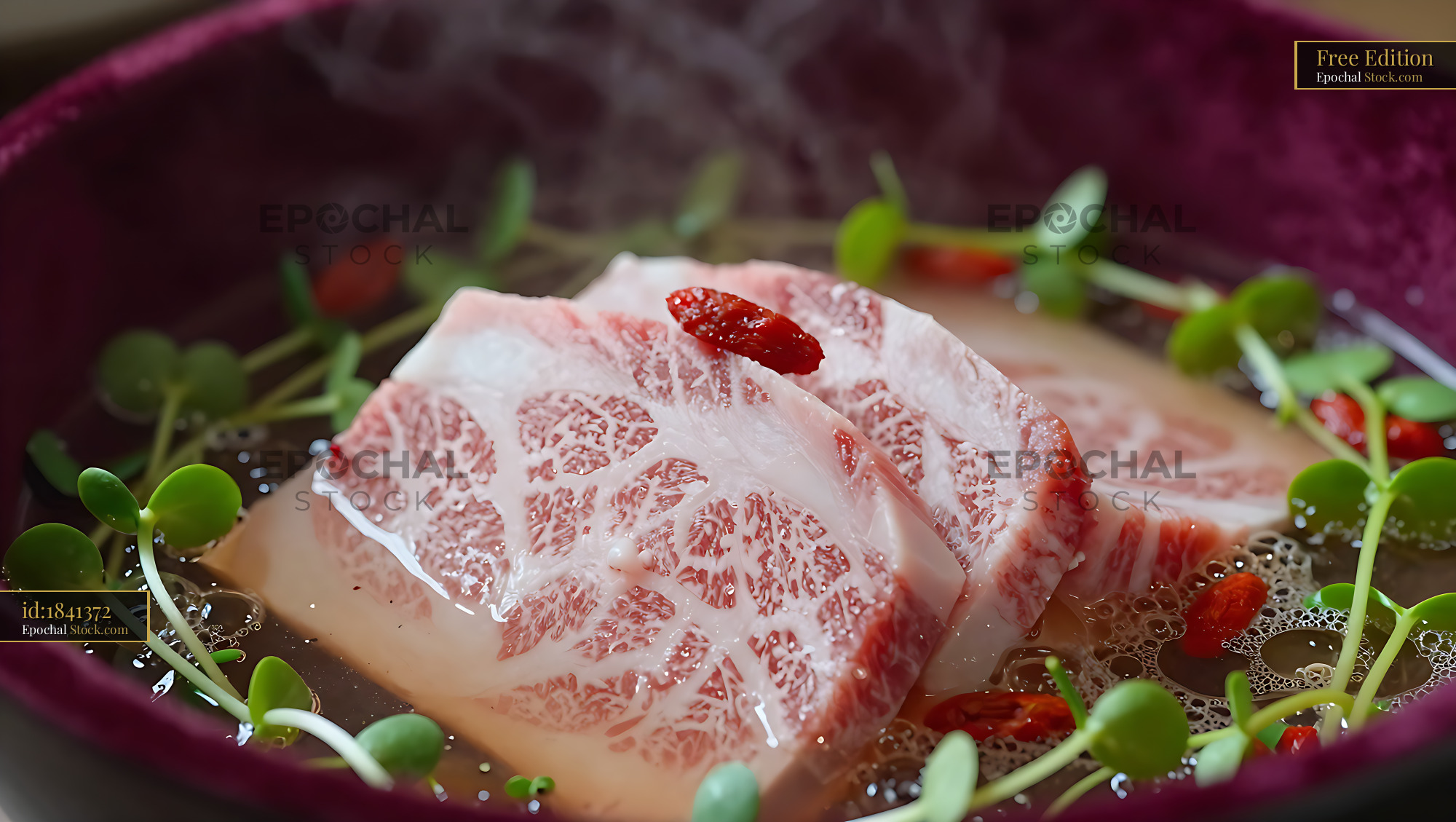 Slices of A5 Wagyu beef in a steaming hot pot with goji berries