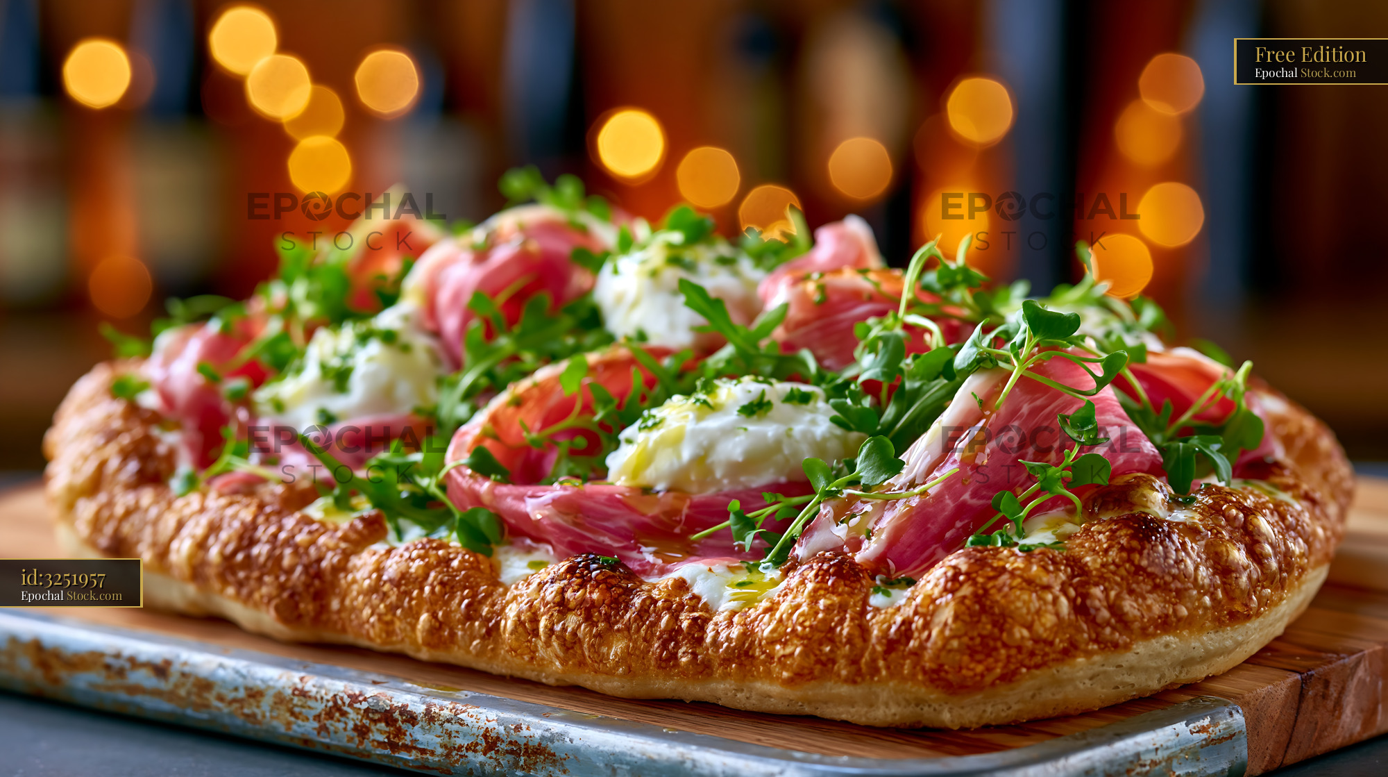 Pinsa romana pizza with prosciutto ham and burrata in warm lighting - stock photo