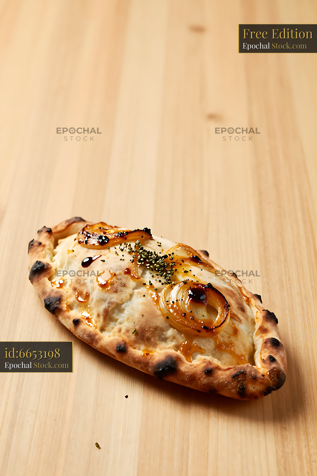 Freshly baked calzone apulian cipolla crown with caramelized onions - stock photo
