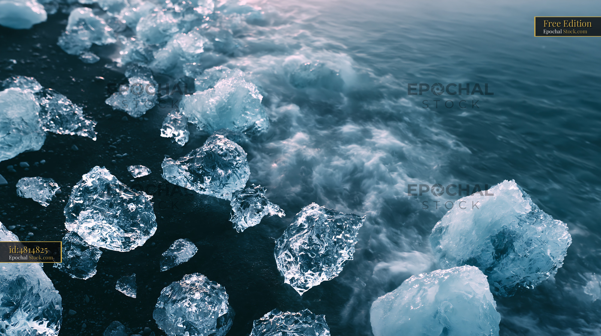 Melting ice blocks on the black sand of Jokulsarlon coast - stock photo