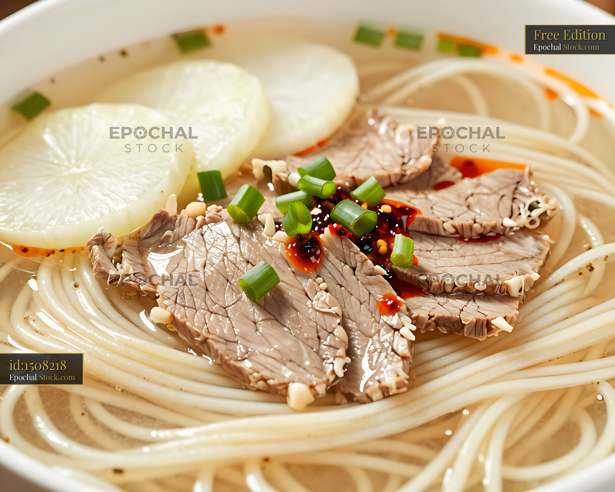 Lanzhou beef noodles with sliced meat and chili oil in clear broth - stock photo