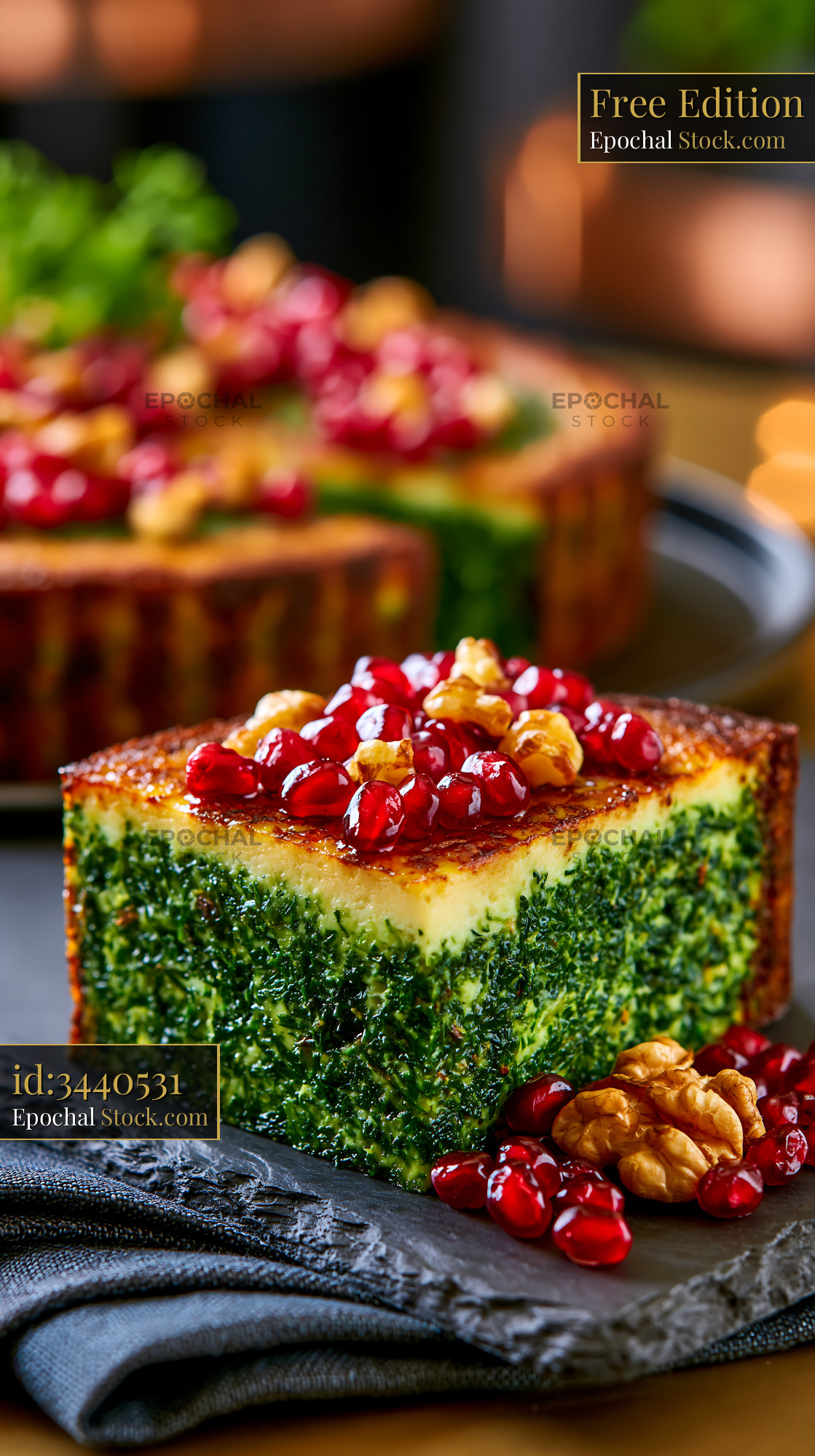 Slice of Persian kuku sabzi herb frittata with pomegranate and walnuts - stock photo