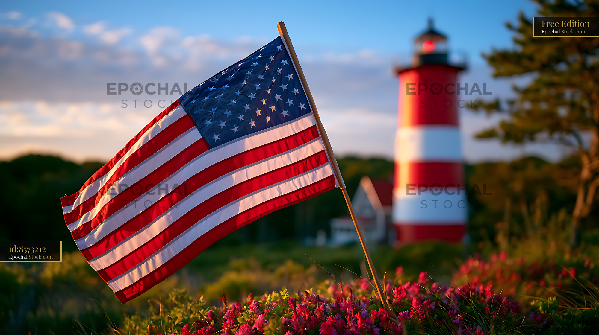 American flag waving in front of a coastal red and white lighthouse - stock photo