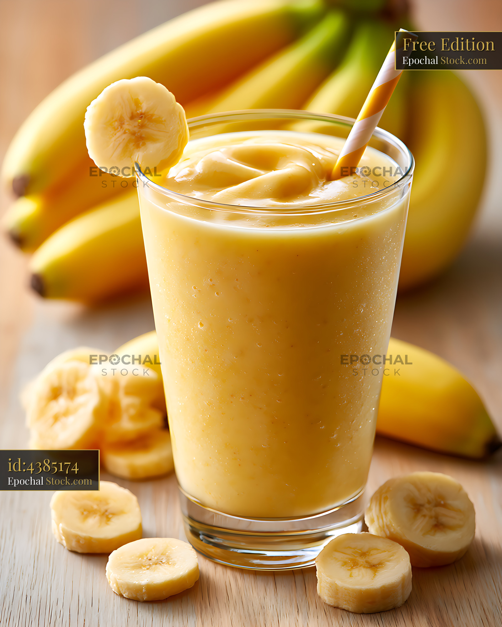 Creamy banana smoothie in a glass with fresh fruit on wooden table - stock photo