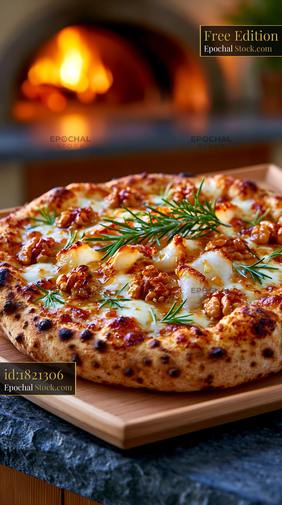 Lardo di colonnata pizza with walnuts and rosemary by a wood oven - stock photo
